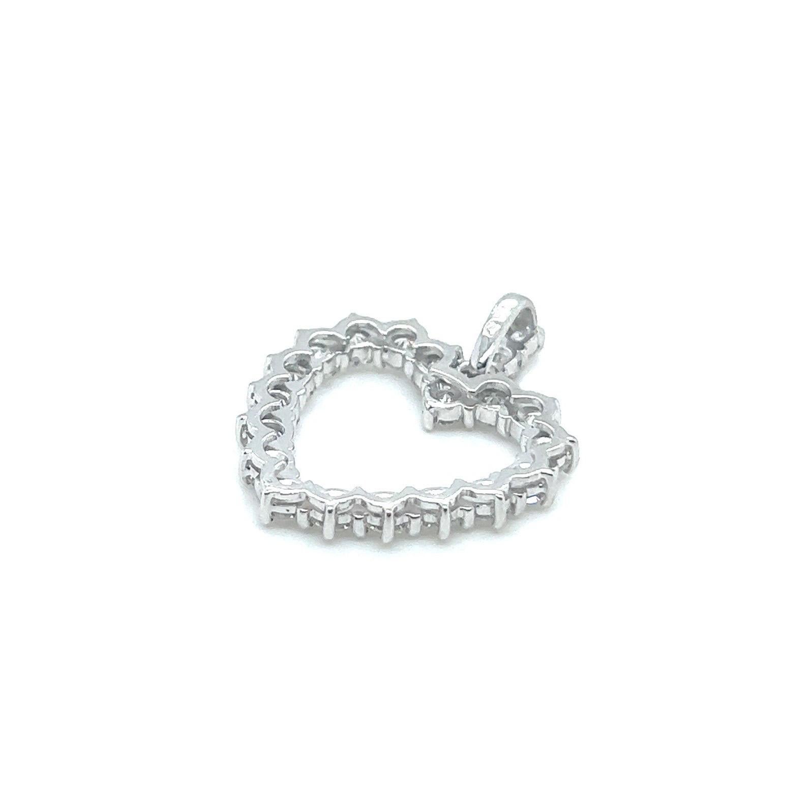 Ravishing 18 karat white gold and 2 carat diamonds heart-shaped pendant.

Crafted in 18 karat white gold, this sparkling heart-shaped pendant is decorated with 18 brilliant-cut diamonds and the bail additionally accented with 3 brilliant-cut