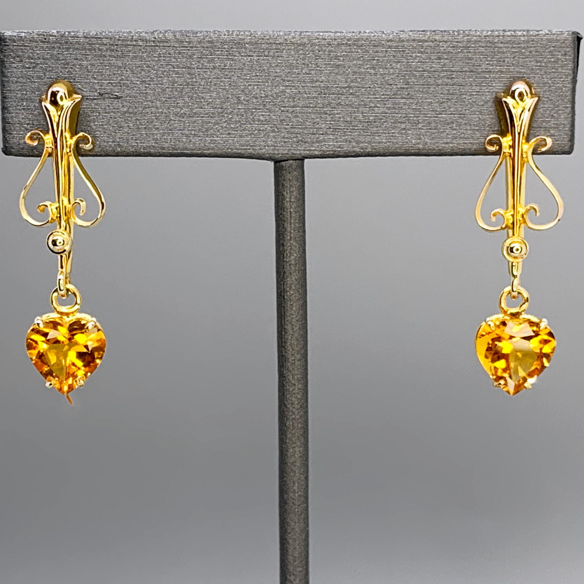 Opulence in simplicity. For these upcycled dangly earrings, I took a vintage brooch likely dating from the 1940's, and reimagined it into a pair of sparkly heart shaped citrine earrings that perfectly blend clean modern design with the delicate