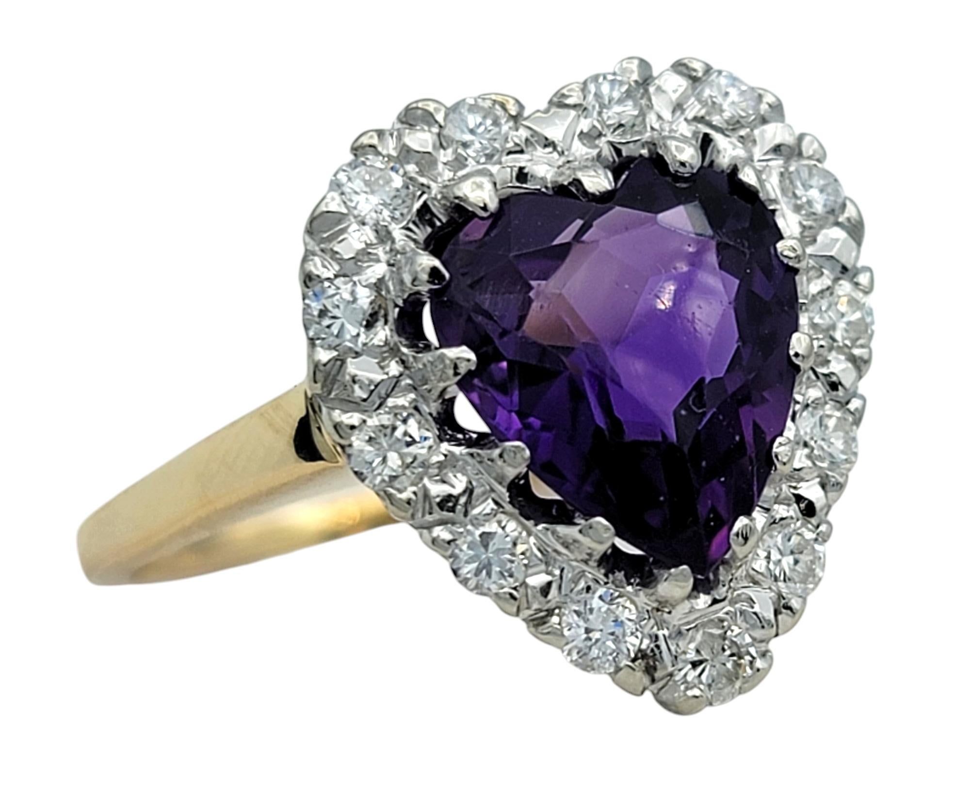 Ring Size: 7.75

Celebrate elegance and romance with this exquisite 14 karat yellow gold ring, featuring a vibrant heart-shaped amethyst at its center. The amethyst showcases a rich purple hue with a striking brilliance. Encircling this breathtaking