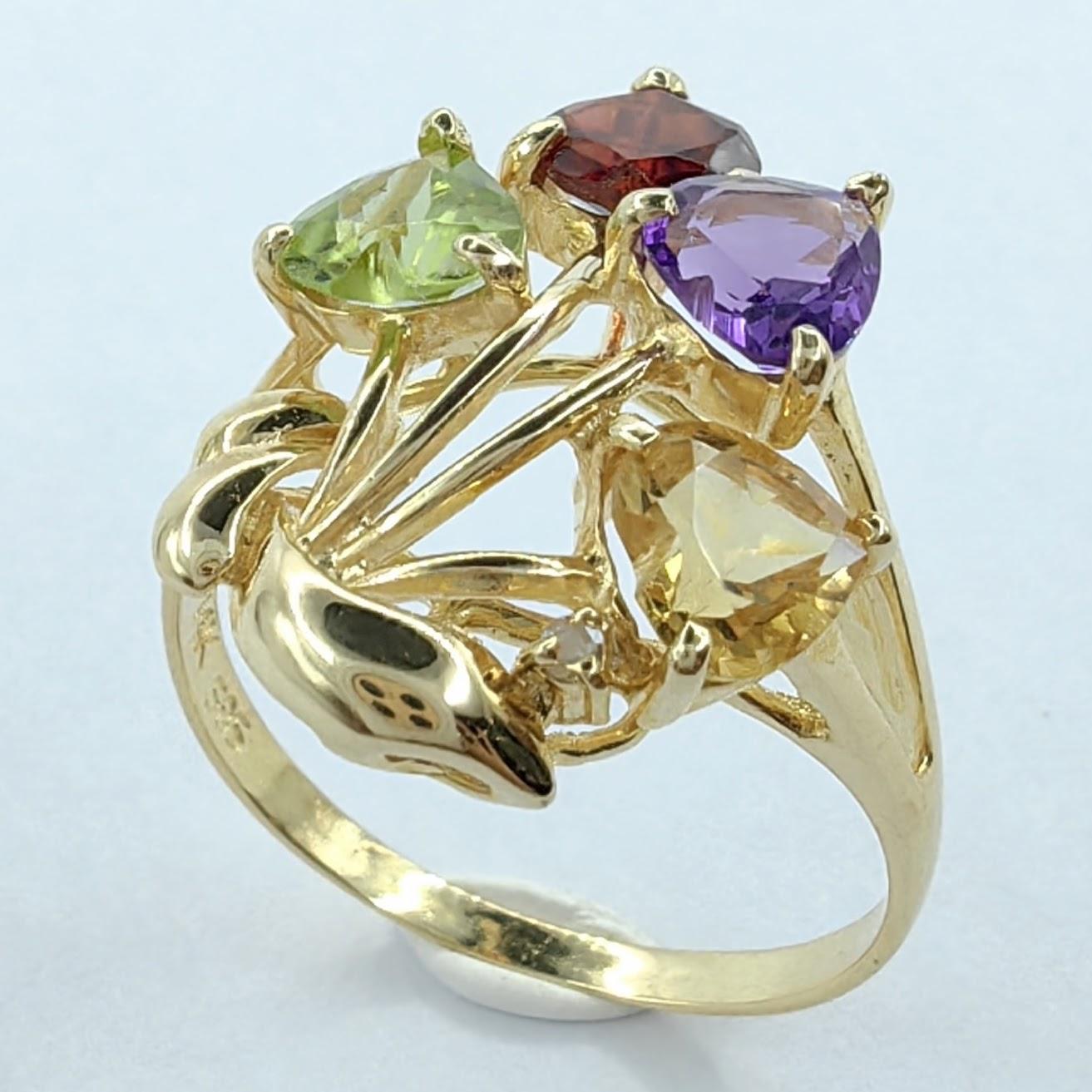 Introducing our captivating Heart Shaped Amethyst, Citrine, Garnet, Peridot Flower Bouquet Ring in 14K Gold. This exquisite ring showcases a stunning arrangement of heart-cut gemstones, each radiating its own vibrant color and carrying symbolic
