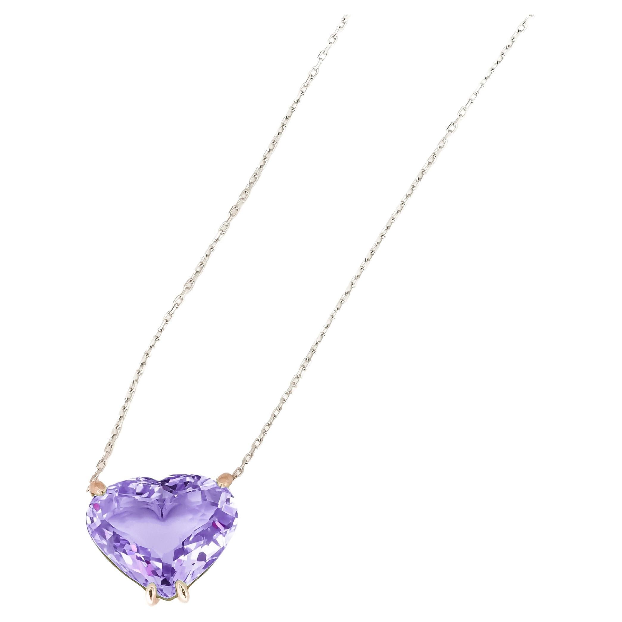Heart shaped amethyst pendant necklace in 14k gold. 