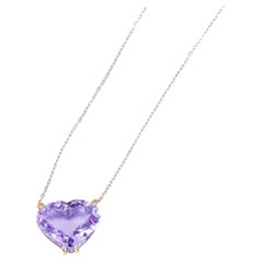 Heart shaped amethyst pendant necklace in 14k gold.