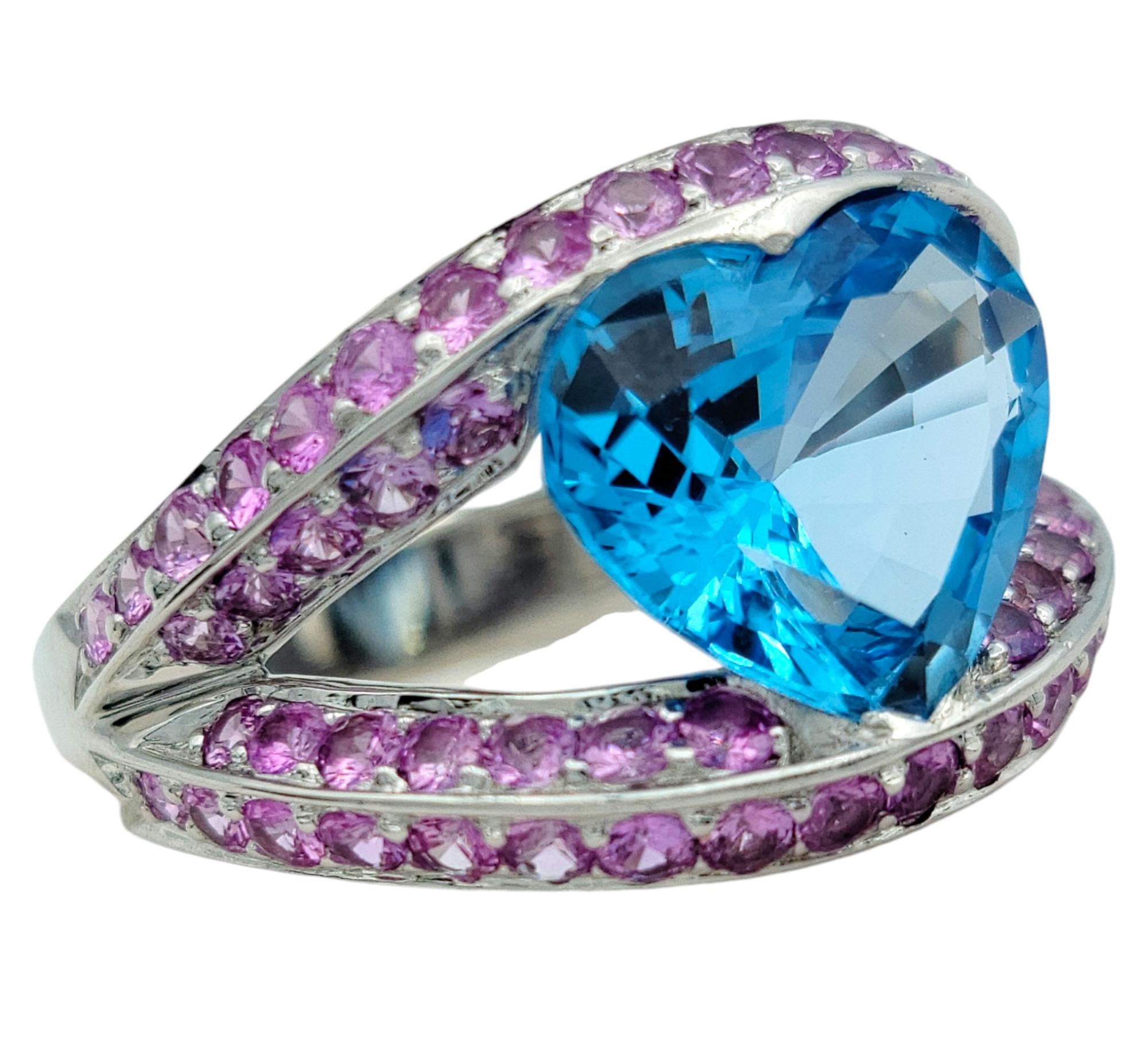 Ring Size: 7

Indulge in the bold beauty of this extraordinary 4.68-carat blue topaz cocktail ring, a striking piece designed to captivate with its unique craftsmanship and vibrant color. At its heart lies a breathtaking heart-cut blue topaz,