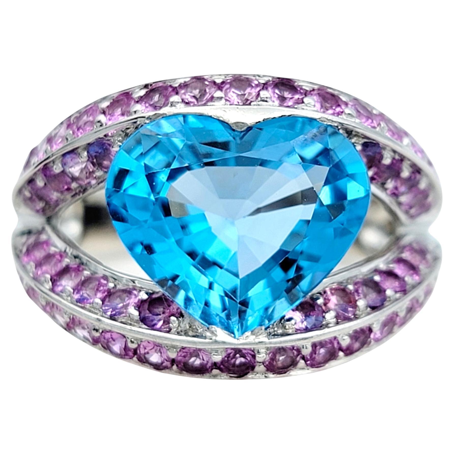 Heart Shaped Blue Topaz Split Shank White Gold Cocktail Ring with Pink Sapphires For Sale