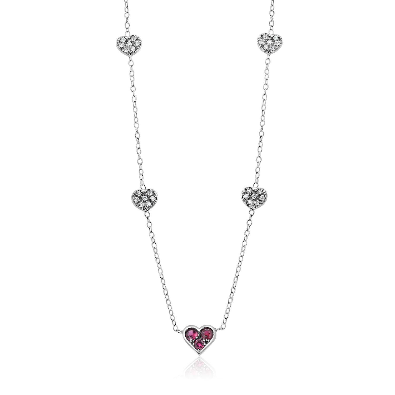 Modernist White Gold Heart Shaped Ruby Charm and Five Diamond Station Charms Neck