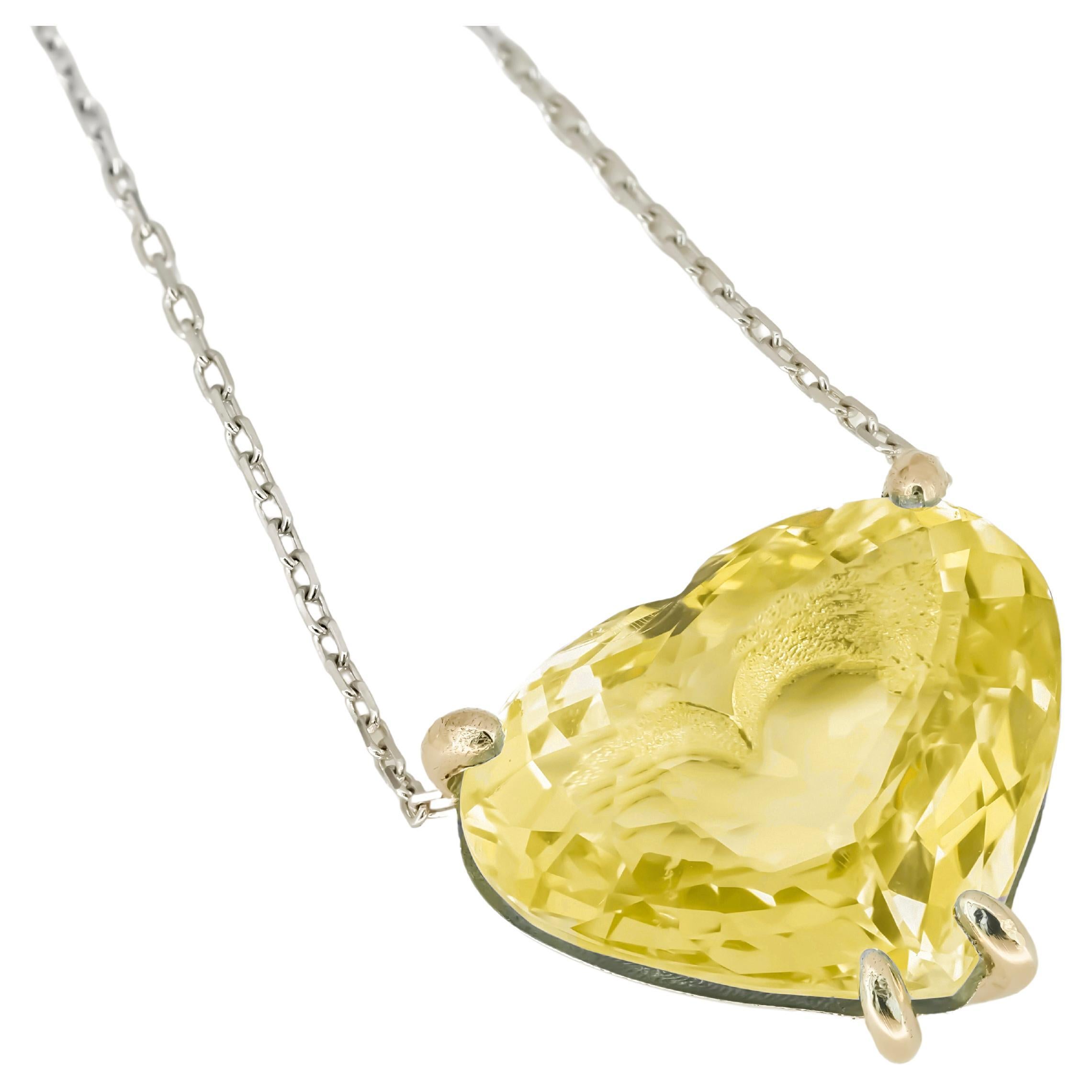 Heart shaped citrine pendant necklace in 14k gold. 
