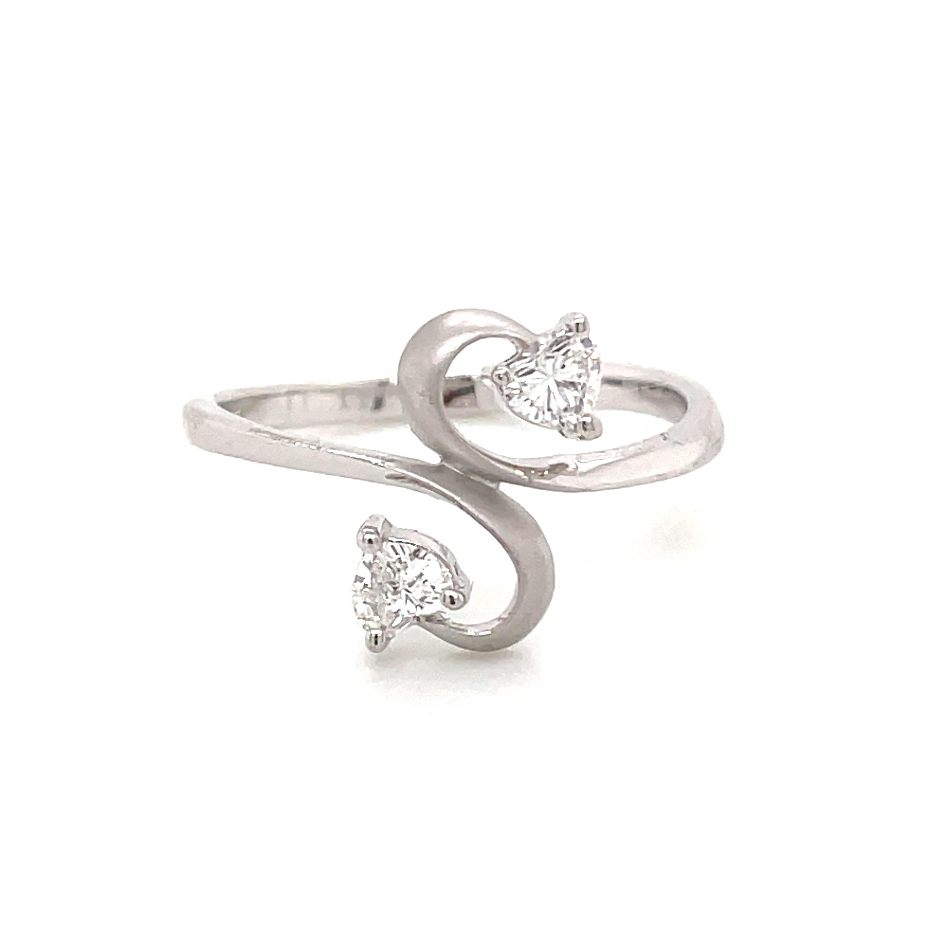 Celebrate love with this Heart-Shaped Diamond and Platinum Engagement Ring! 

Featuring two charming heart-shaped white diamonds, totaling 0.24 carats, this ring is a symbol of affection and commitment. 

Notably, these two heart-shaped diamonds