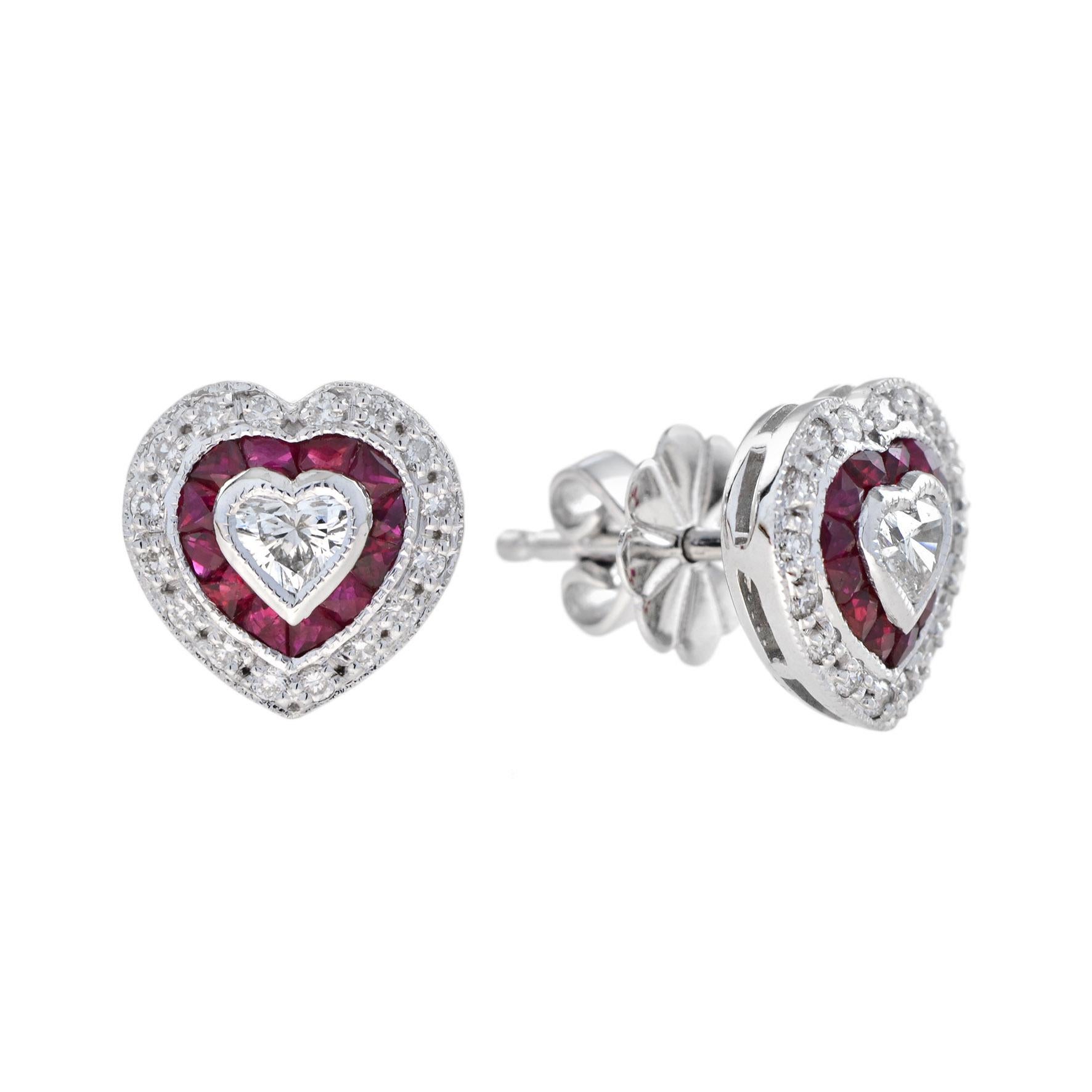 Crafted in 14k white gold, these lovely heart shaped stud earrings and pendant jewelry set  offer a beautiful combination of sophistication and charm. The center heart shaped diamonds grade G color, VS clarity. A frame of French cut rubies, and