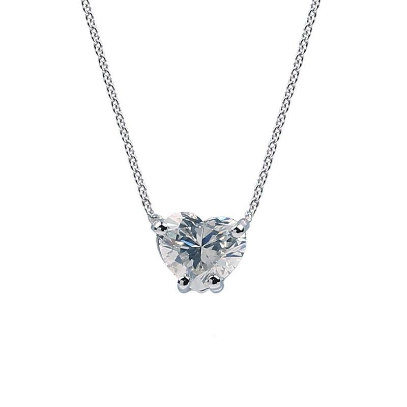 Heart-Shaped Diamond Pendant Necklace. A 0.40ct H SI1 heart-cut diamond is set in 18K white gold. Attached to an adjustable 16-18″ White Gold Chain.

Heart-Shaped Diamond: 0.40ctw. H Color, SI1 Clarity
White Gold: 18K 
Weight: 1.32Gr.
