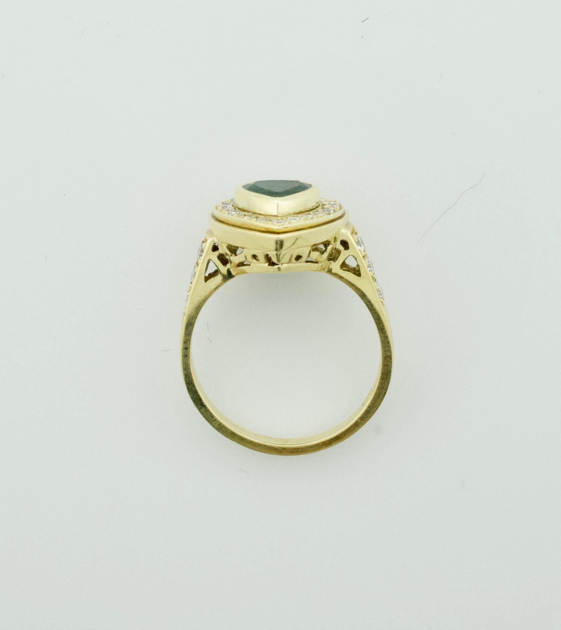 Heart Shaped Emerald and Diamond Ring in 18k Yellow Gold
Simple and Sweet for You or Your Sweet
One Heart Shape Emerald Weighing .72 Carats 
Twenty Three Round Brilliant Cut Diamonds Weighing .62 Carats 
Currently Size 6.5 Can Be Sized By Us Or Your