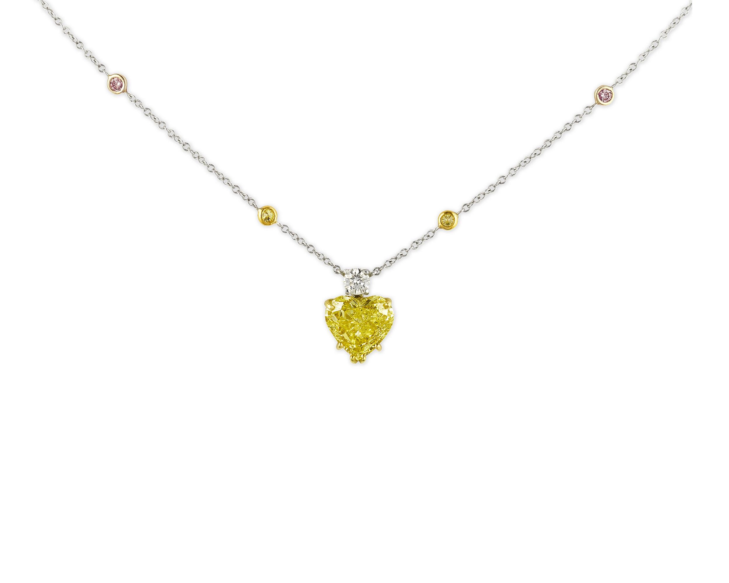 Feminine and romantic, this heart pendant is formed by a 2.42-carat fancy vivid yellow diamond. The remarkable colored diamond is certified by the Gemological Institute of America as being all-natural, with the impressive clarity grade of Internally