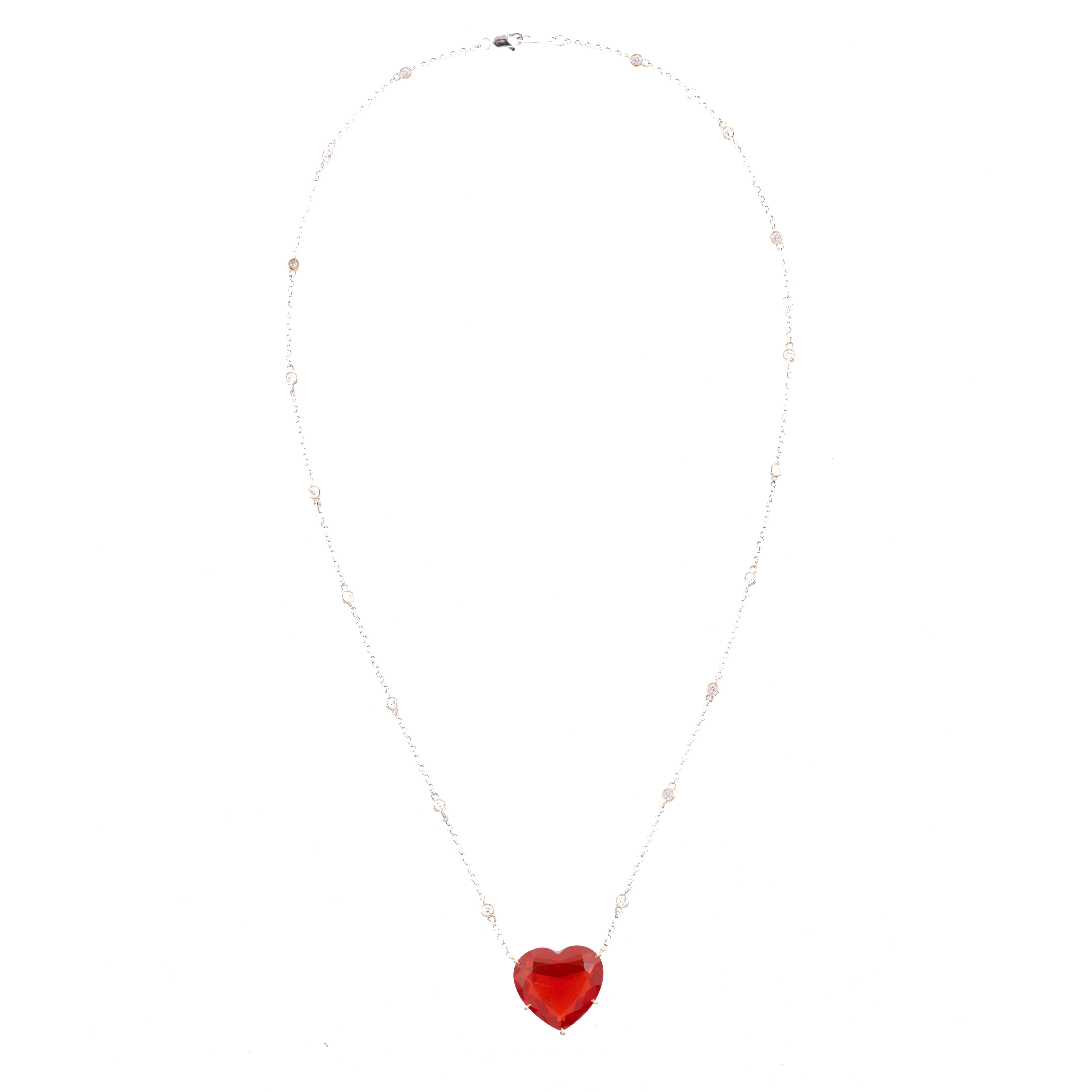 An 18k yellow gold handmade setting by Rahaminov framing a one-of-a-kind heart shaped fire opal. The necklace was designed around its incredible featured gemstone, its 18.31 carat fire opal of a fiery reddish-orange hue. The opal was cut specially