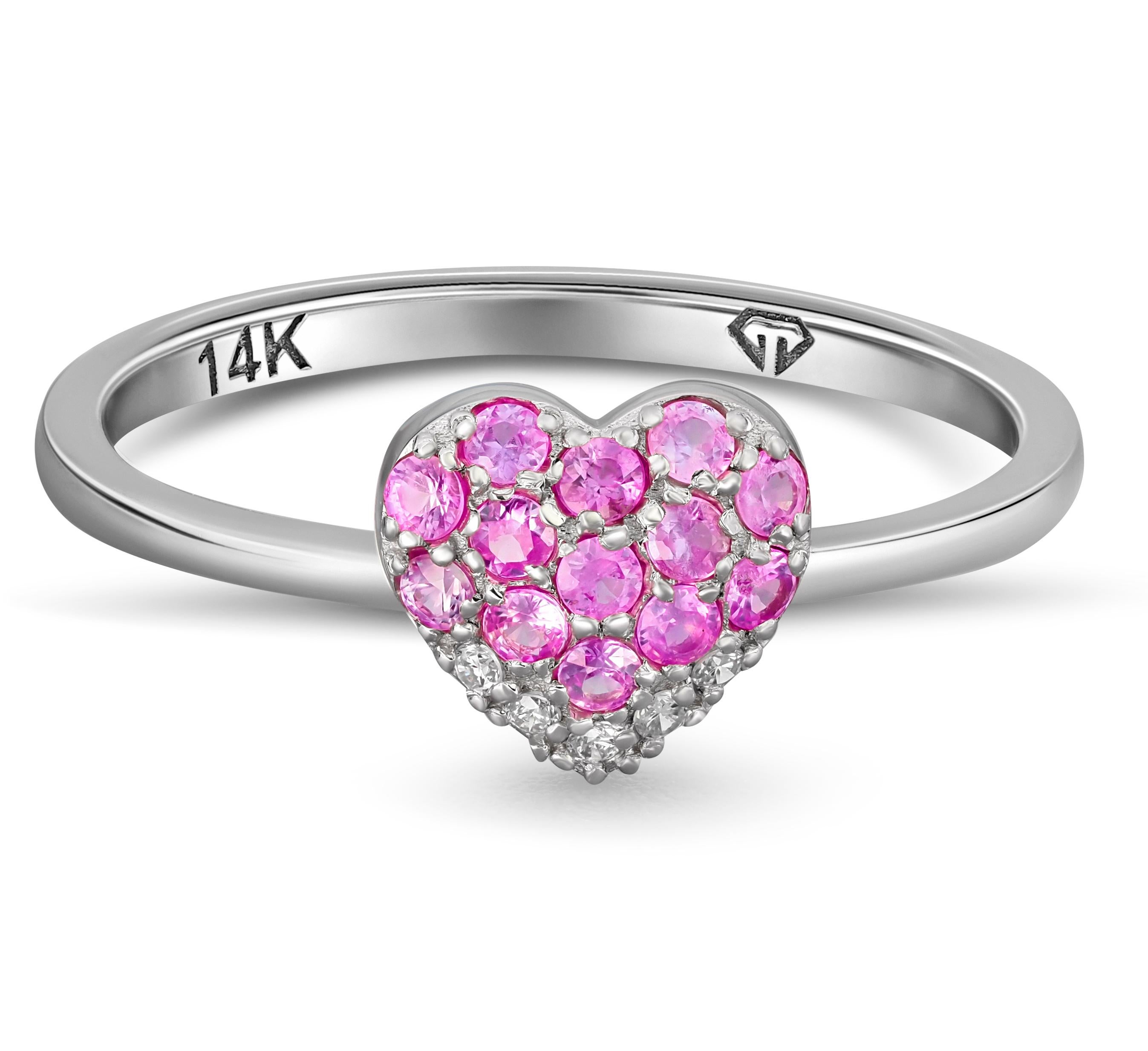Heart shaped gold ring with pink sapphires. 
Natural pink heart sapphire ring. Round cut pink sapphire 14k gold ring.

Metal: 14k gold
Weight: 1.5 g. depends from size

Gemstones:
Sapphire: color - pink
Round cut, weight - approx 0.39 ct in total