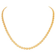 Heart shaped link chain necklace in 24k yellow gold.