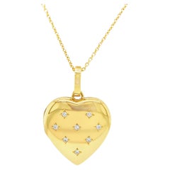 Collier pendentif médaillon en forme de cœur, or jaune 18 carats, 8 diamants 0,16 carat