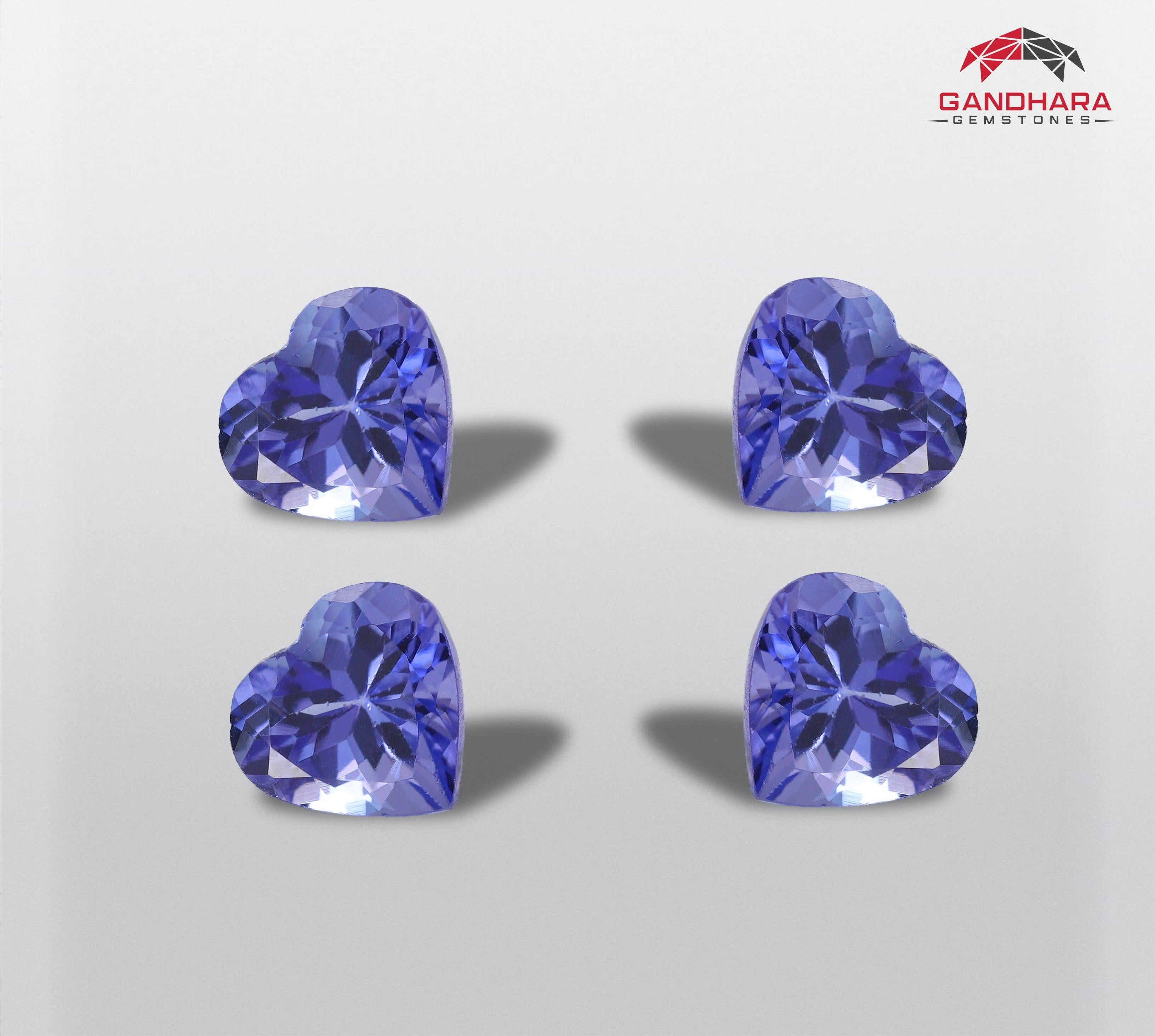 Heart shaped Tanzanite set, available for sale at wholesale price, natural high quality, Eye clean Clarity 4.80 carats (1.20 carat each) loose tanzanite gemstone from Tanzania.

Product Information:
GEMSTONE TYPE	Heart shaped Tanzanite