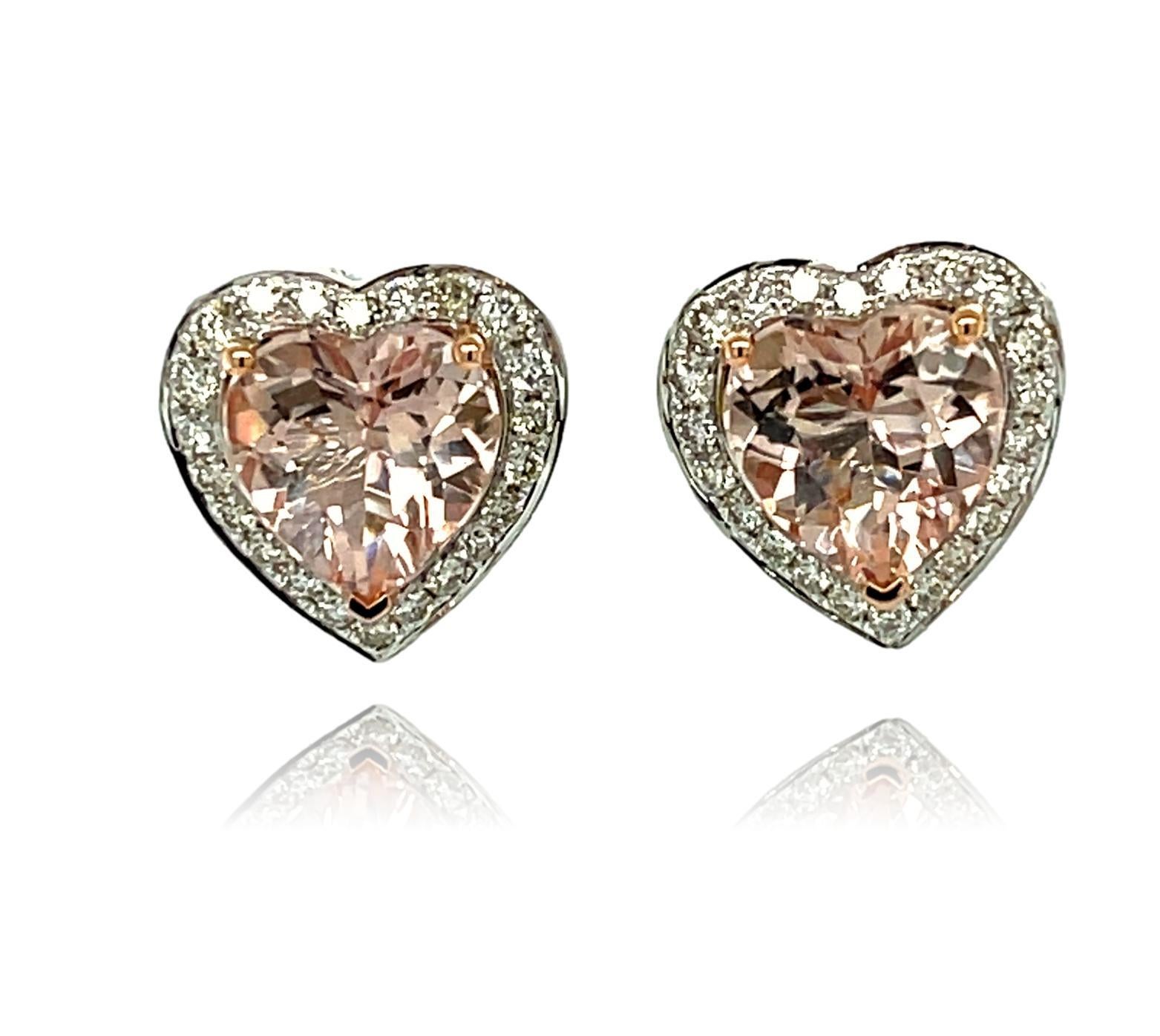 These adorable Heart shaped Morganite stud earrings have a halo of shimmering diamonds around them. The center stone has three prong setting in Rose gold for the perfect accent. There is a double push lock closure for extra security. These earrings