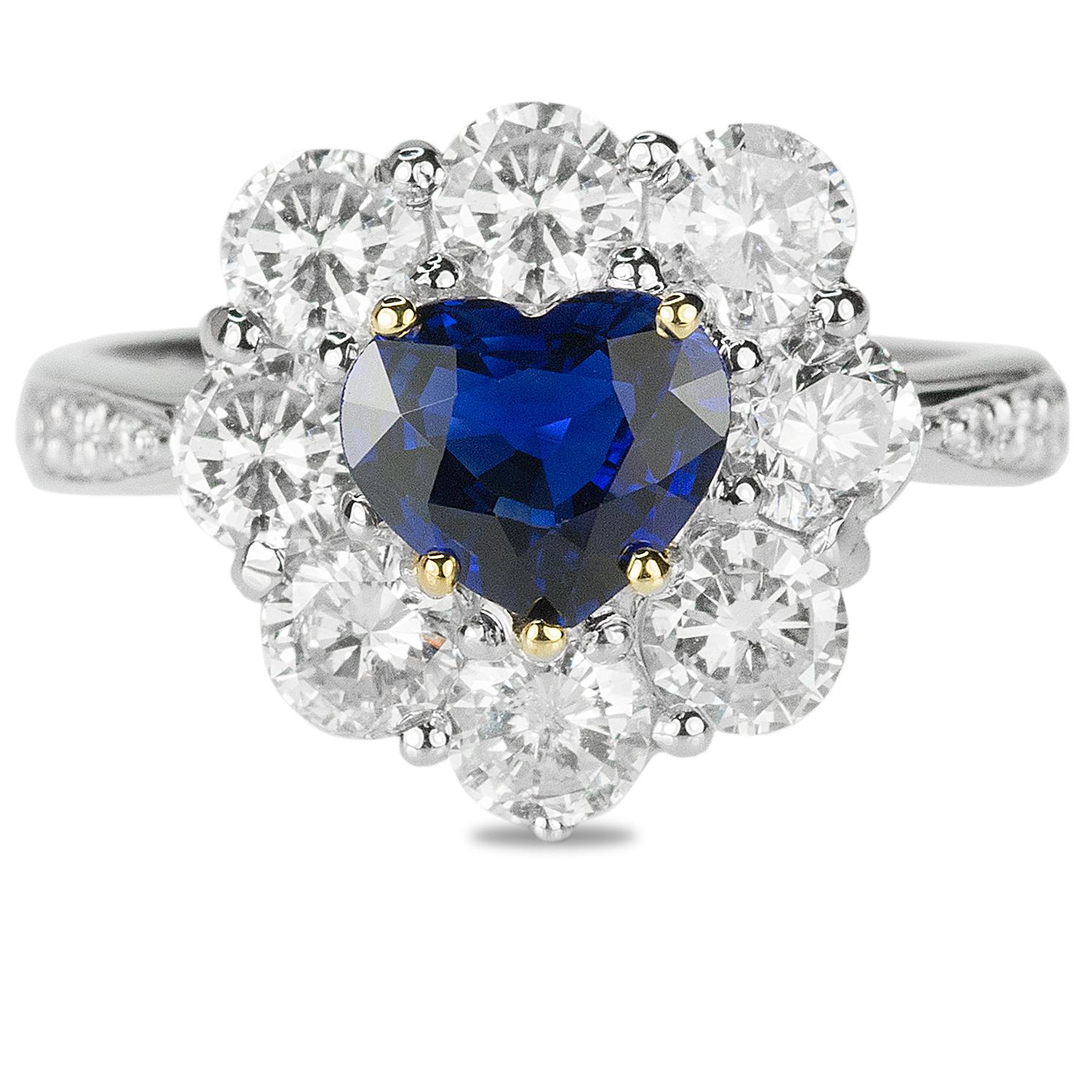 Platinum ring with GRS certified 0.99 carat unheated heart shape sapphire and 1.43 carats of collection color/clarity round brilliant diamonds. Complimentary expert ring sizing included.