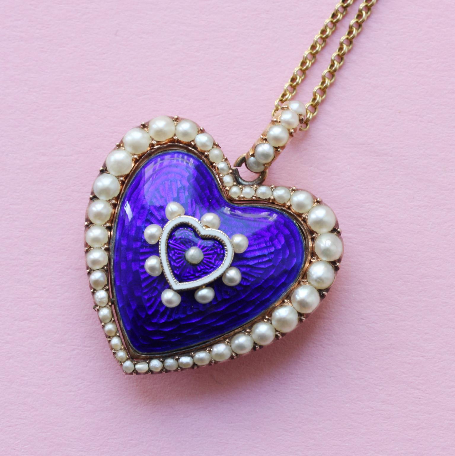 A 15 carat gold large blue enamel and pearl heart shaped Victorian locket, circa 1880, England, visible repairs at the back.

weight: 11.52 grams
dimensions: 2.8 x 3.4 cm