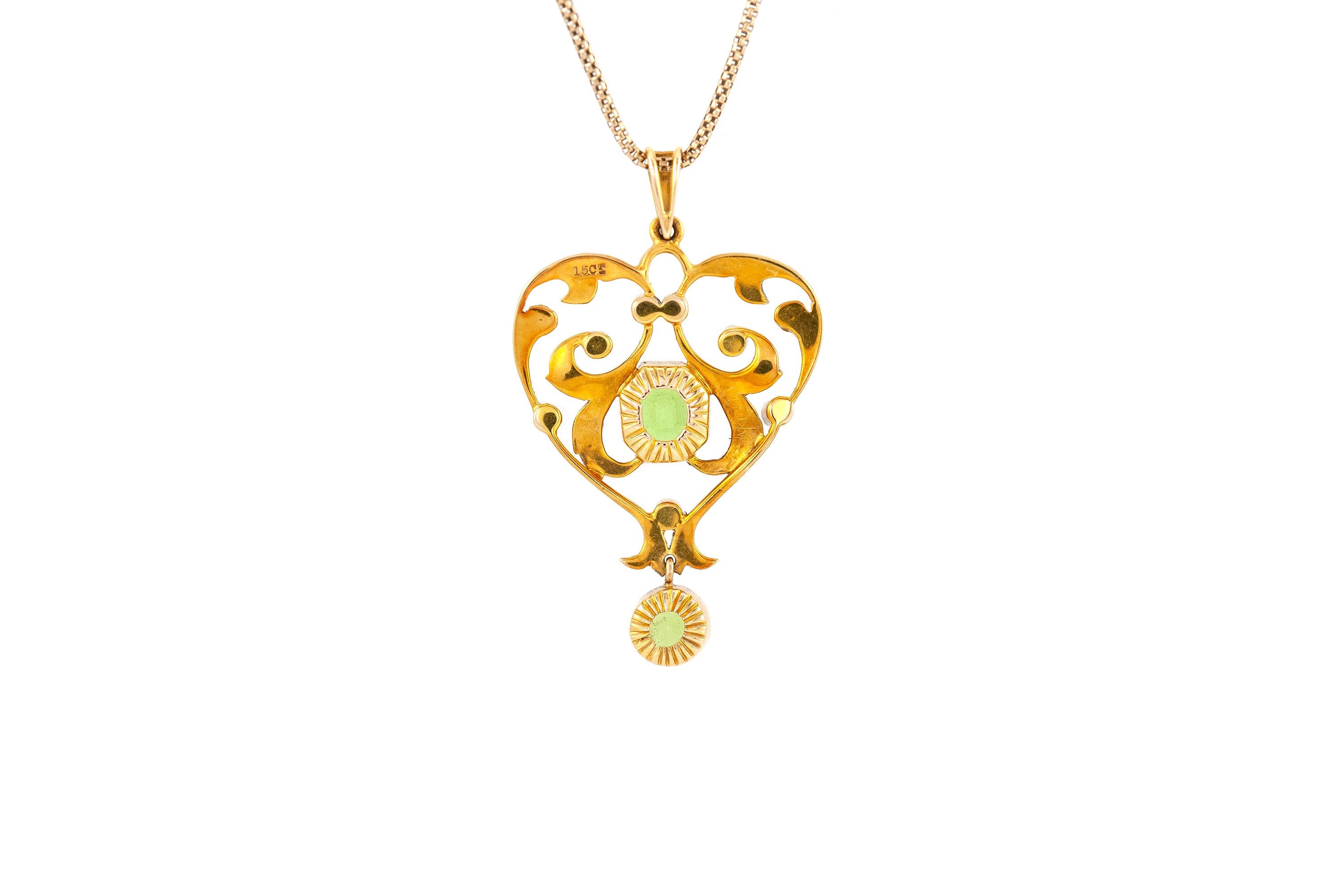 The necklace is finely crafted in 14k and 15 yellow gold with pearls and tourmalines. Circa 1920.