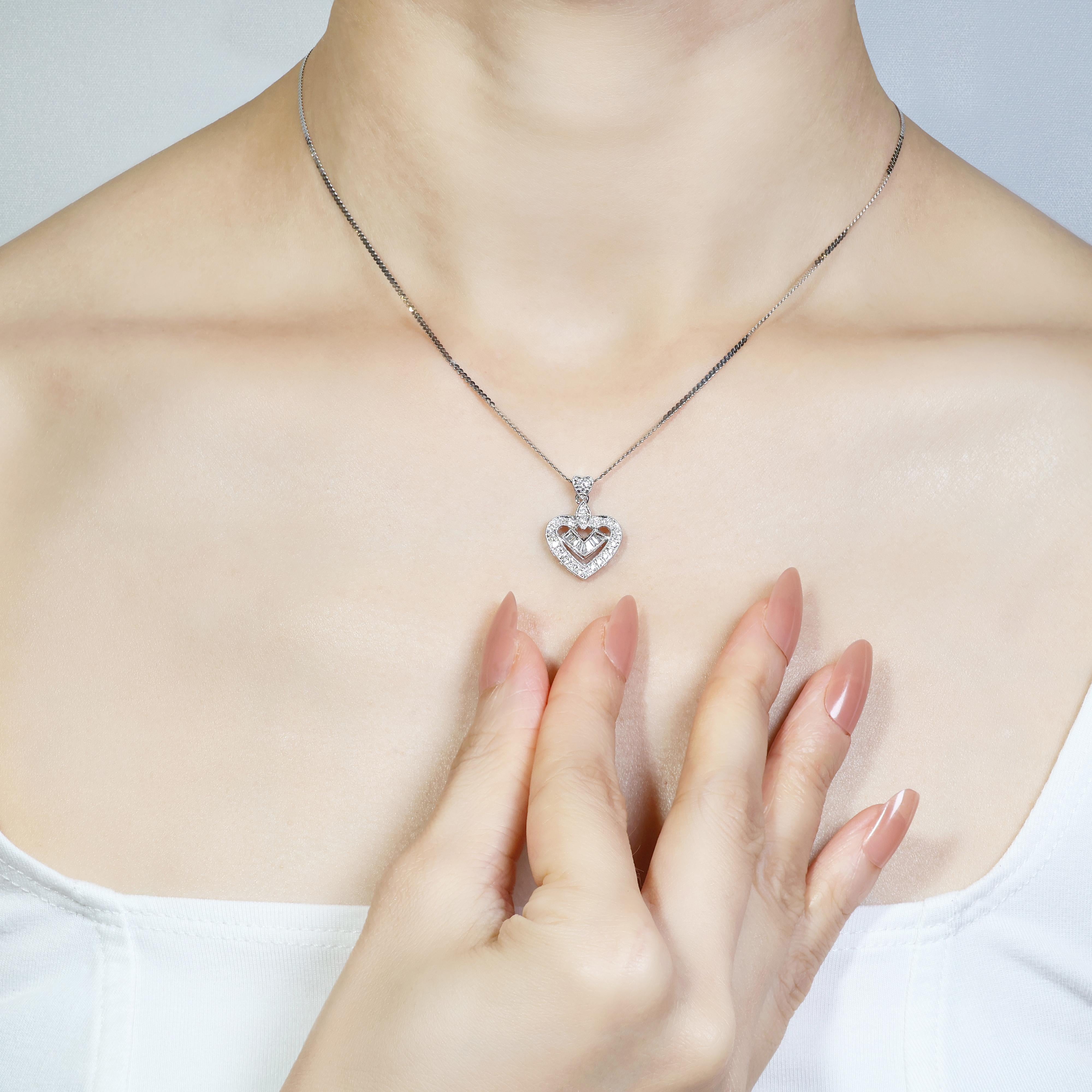 Elevate your style with this stunning 18k white gold diamond pendant. Adorned with 33 round brilliant diamonds, including 26 in the center and 7 taper-cut side stones, this pendant is a true showstopper. The diamonds, all graded G in color and SI or