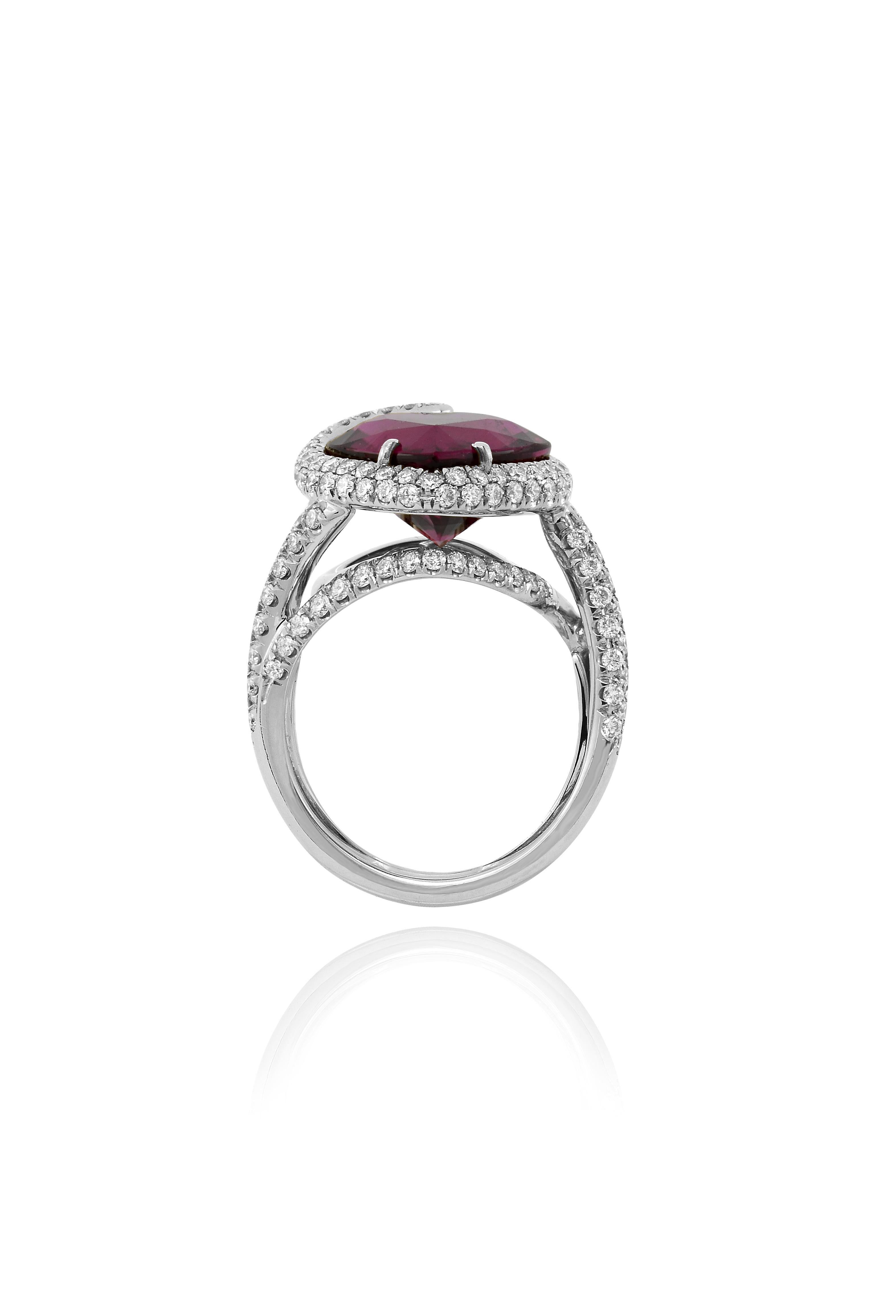 This enchanting ring  had been handcrafted  in Margherita Burgener workshop, based in Italy.
The ring centers a beautiful, clean, vivid red, heart shaped rubellite tourmaline. 

Matching earrings are shown in the gallery and can be  bought