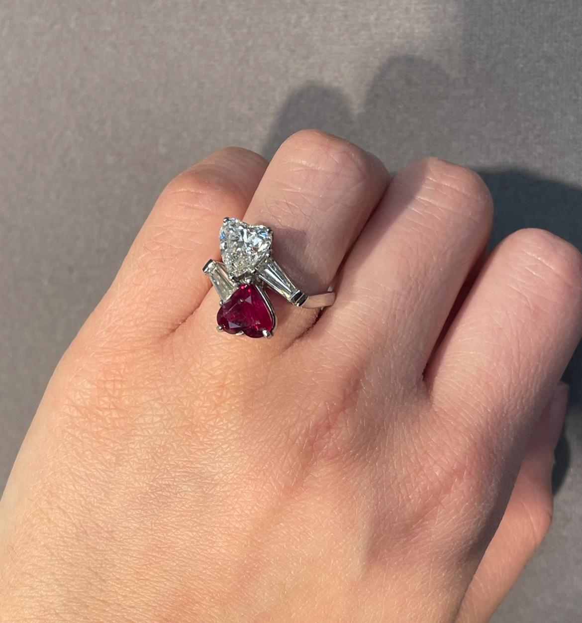 Heart-Shaped Ruby and Diamond You & Me Ring 

A platinum You & Me ring with a heart-shaped diamond and ruby set with two tapered baguette diamonds.

The 2.19 carat diamond is accompanied by a GIA certificate
Thje 1.64 carat uby is accompanied by a
