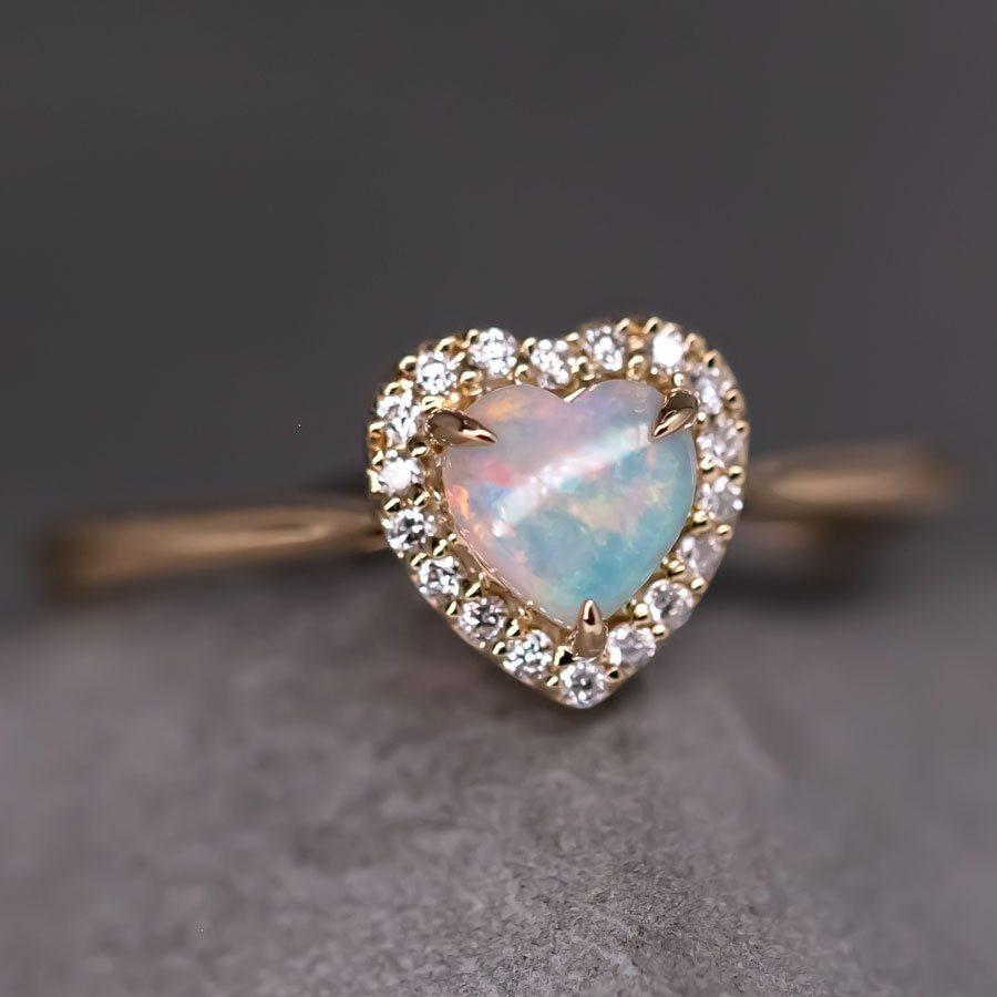 Heart-Shaped Australian Solid Opal Halo Diamond Engagement Ring in 18K Yellow Gold. 




Free Domestic USPS First Class Shipping! Free Gift Bag or Box with every order!

Opal—the queen of gemstones, is one of the most beautiful gemstones in the