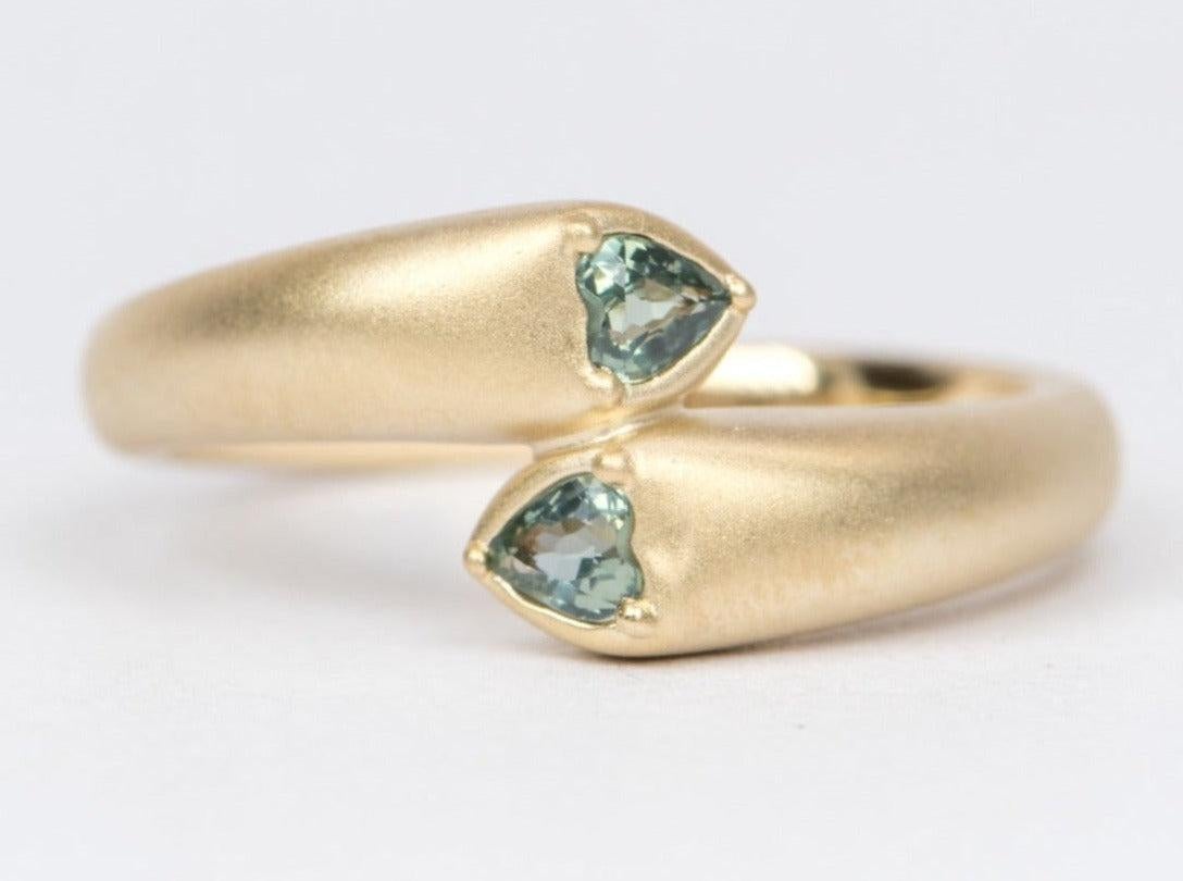 ♥ A solid 14K yellow gold matte ring set with two heart shaped teal sapphires in a puffy dome style
♥ Beautiful blue green color! 

♥This setting measures 12.2 in length, 10.4mm in width, and 5.7mm in height

♥ Ring size: US 7 (Free resizing up or