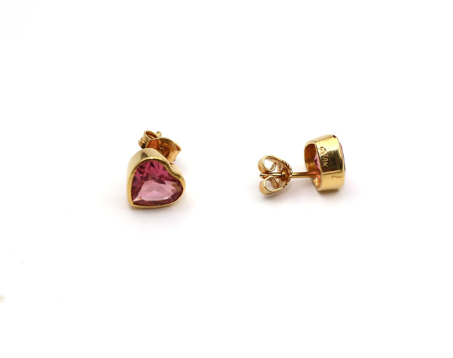 Finely and really rare Heart-shaped Tourmaline stone stud Earrings.
They sit perfectly on the ear. Bringing some style and romance to everyday outfits. 

A natural Tourmaline color is really sophisticated shade of red and purple. A unique