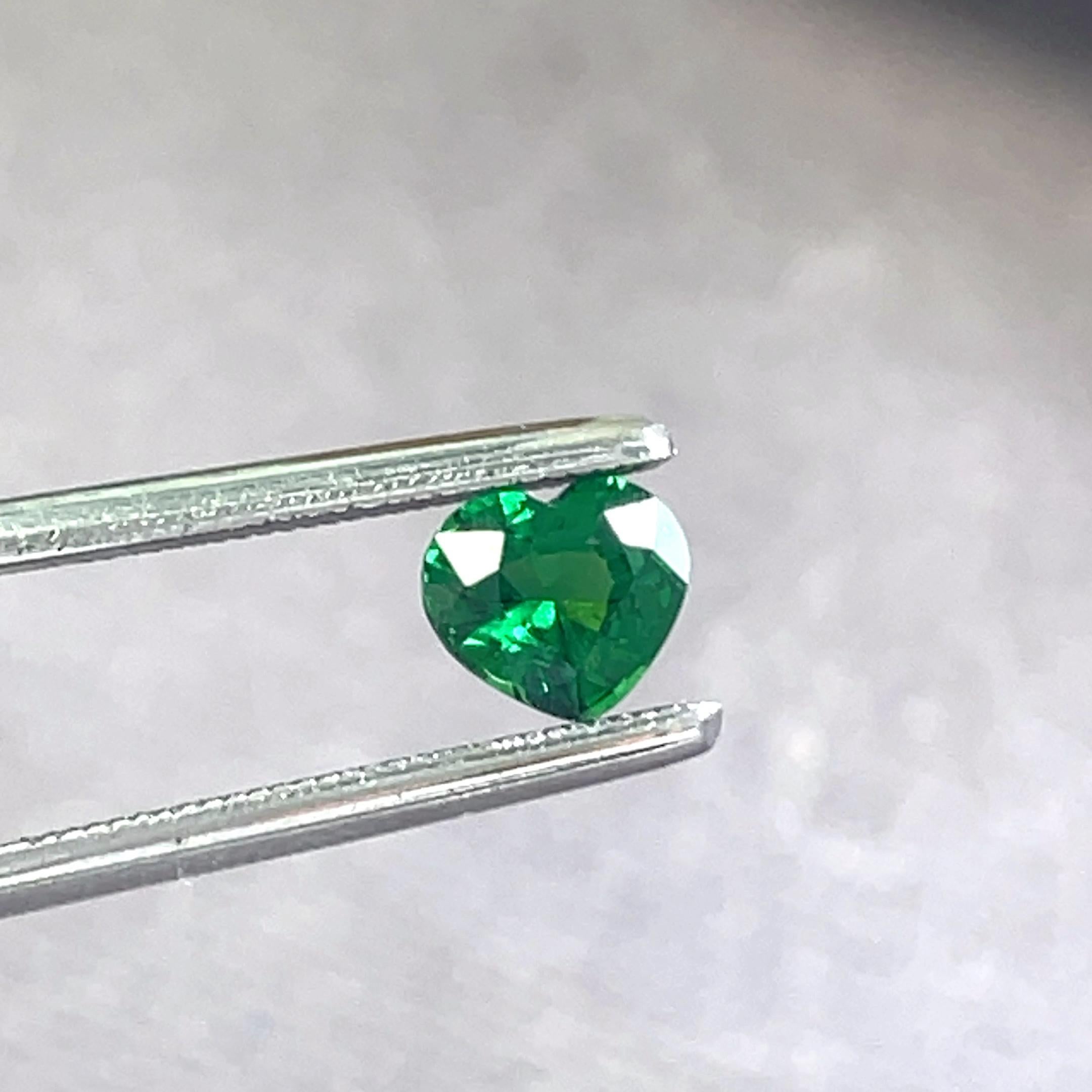 This 0.77 carat heart-shaped tsavorite gemstone was expertly and passionately crafted to represent the essence of vigor and rejuvenation. 

An ideal talisman for anyone looking to draw luck and optimism into their life because of its rich green