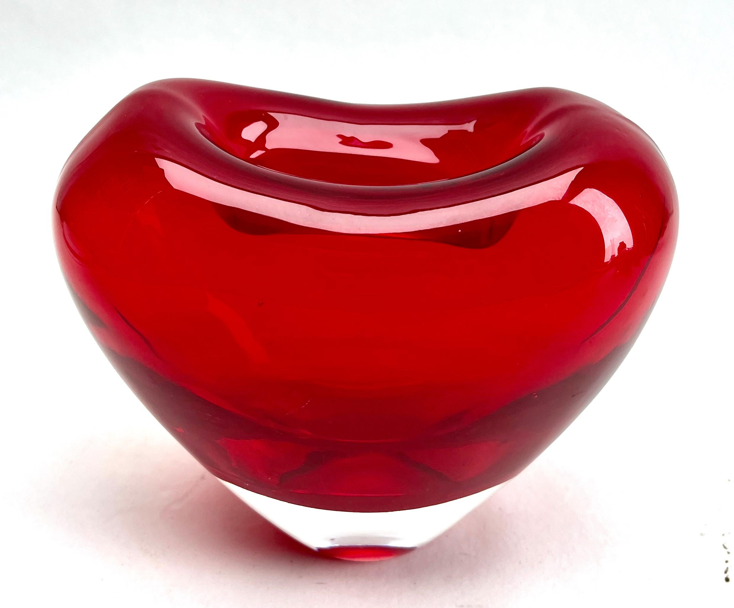 The iconic heart-shaped vase. Salviati collection, designed by Maria Christina Hamel. Ruby red heart with flat base. Hand-blown Murano glass.

The piece is in excellent condition and a real beauty!

Please don't hesitate to get in touch with any