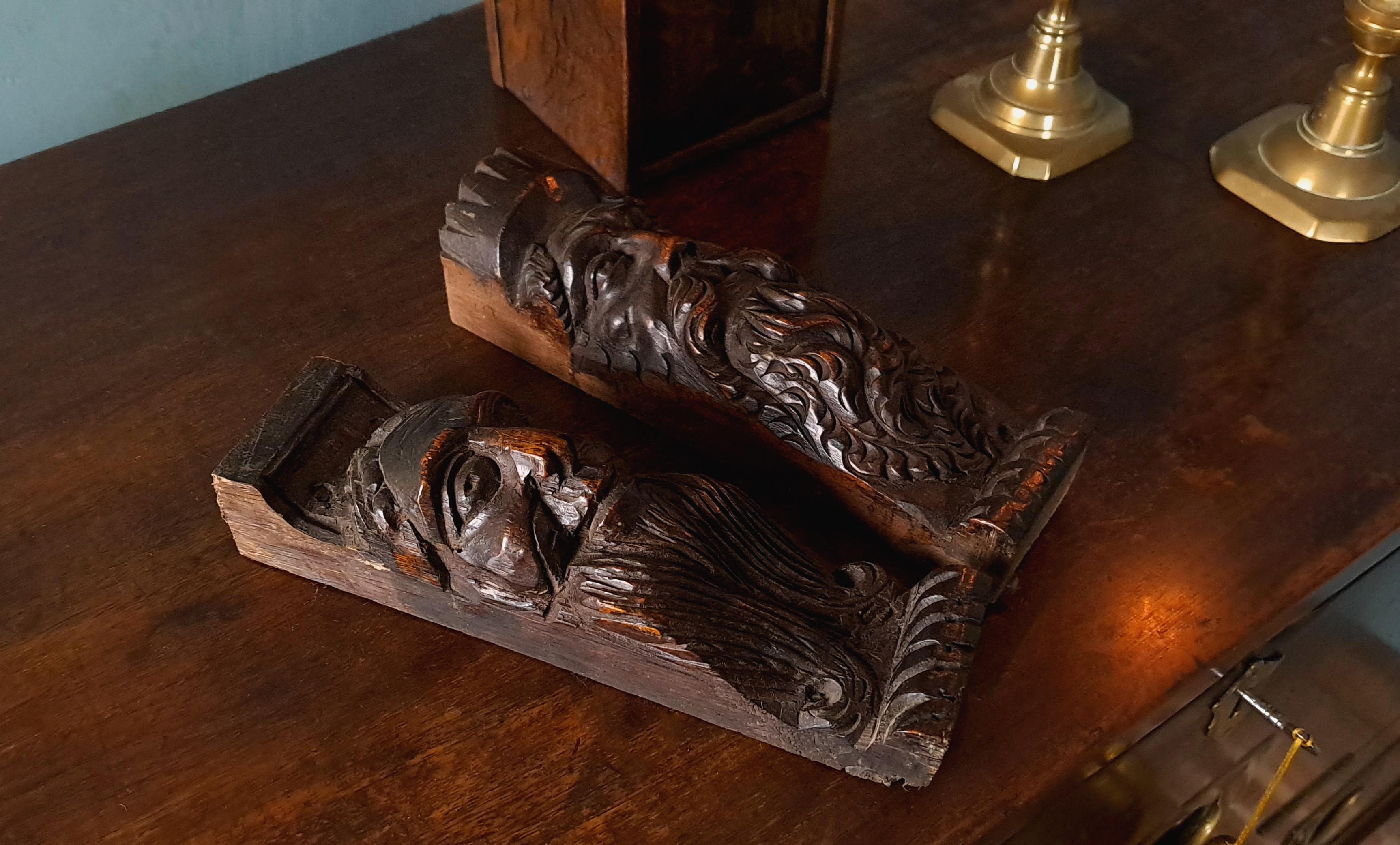 A pair of handsome and heart-warming carved oak faces, believed to originally have been adorning a large cupboard and which were carved by skilled hands in the second or third quartile of the 17th century.

With a really good colour, wonderful