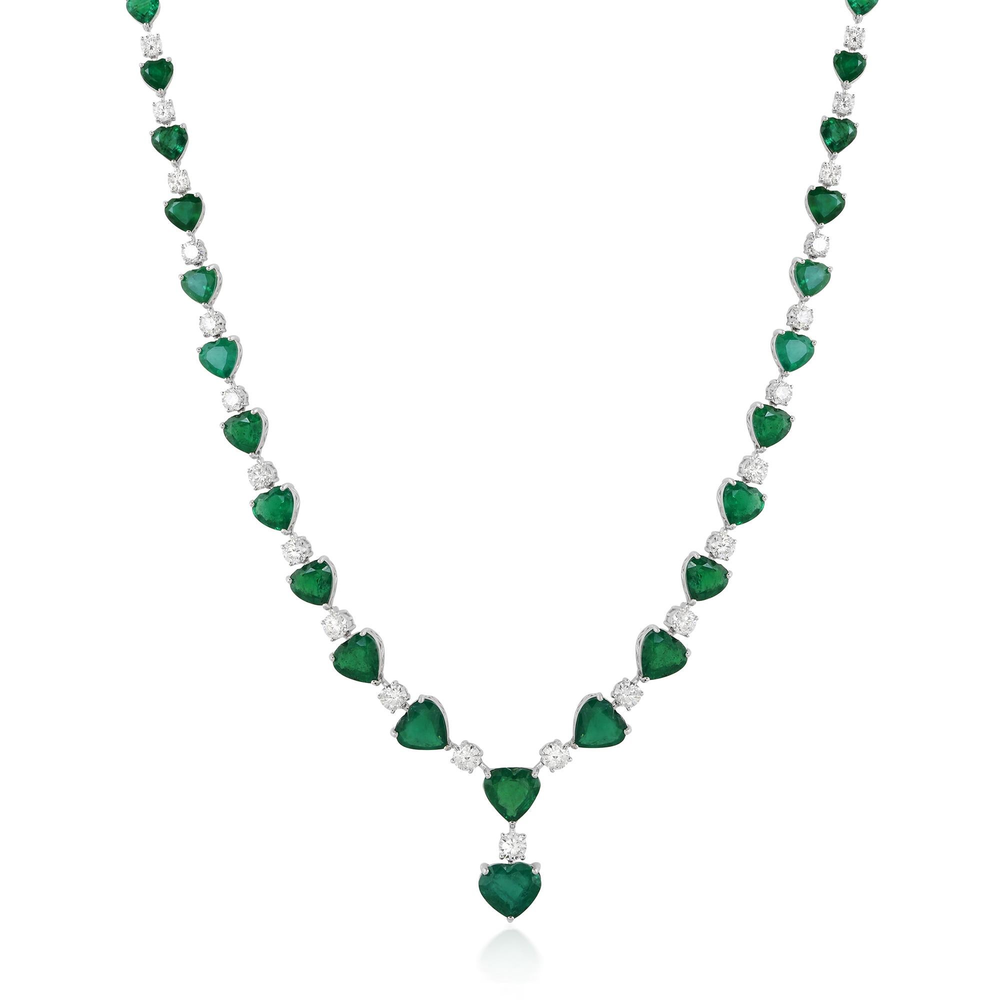 Indulge in the mesmerizing allure of this exquisite Heart Zambian Emerald Gemstone Necklace, a true testament to elegance and sophistication. Crafted with the utmost precision and artistry, this necklace is a stunning example of fine jewelry at its
