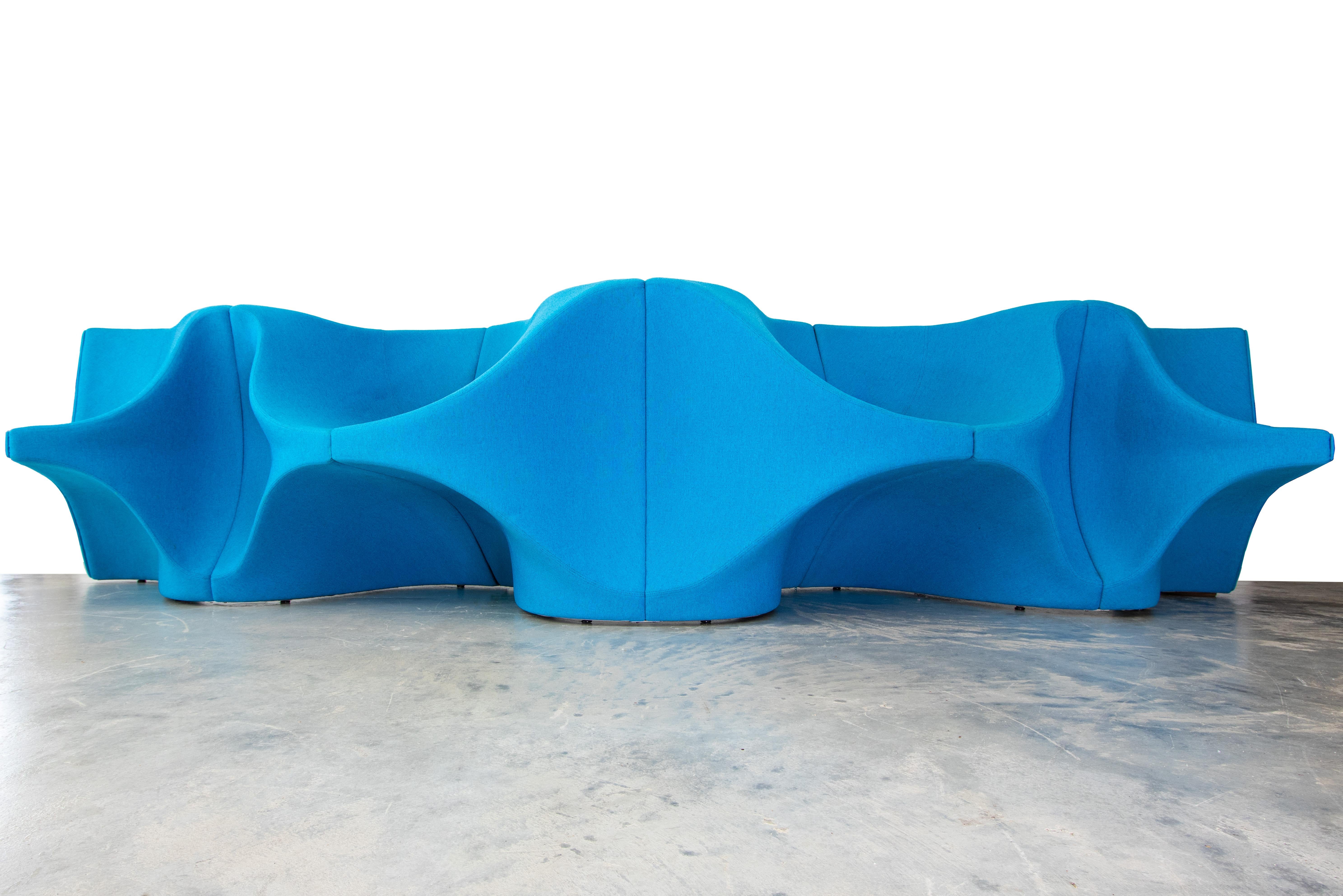 The heartbeat sofa blends sculpture and form. This sofa consists of three individual units (one concave and two convex units) that form a 5 seat sofa three facing one direction and one two seats facing the opposite direction. Made to float in a room