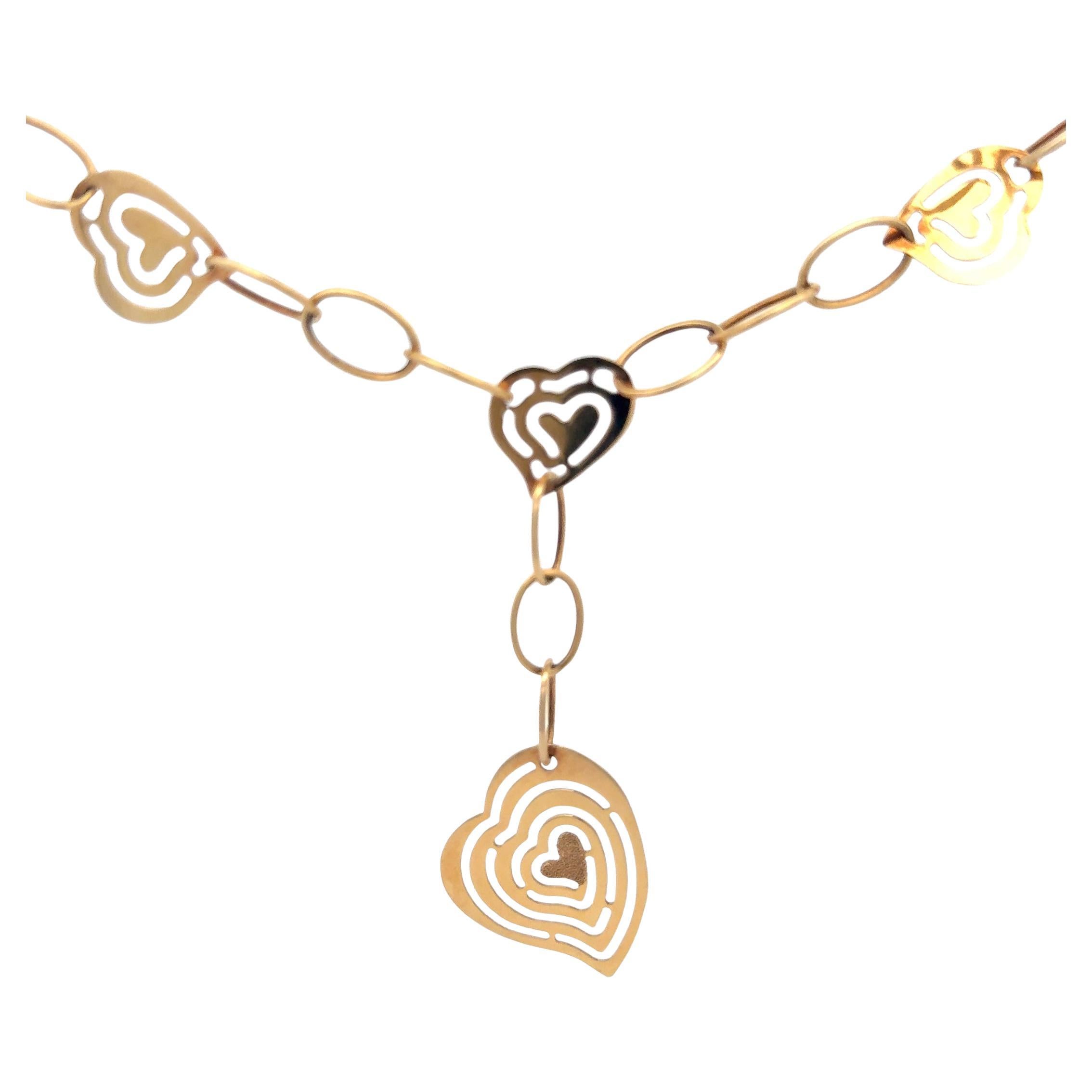 Collier pendentif cœurs et maillons en or jaune 14 carats en vente