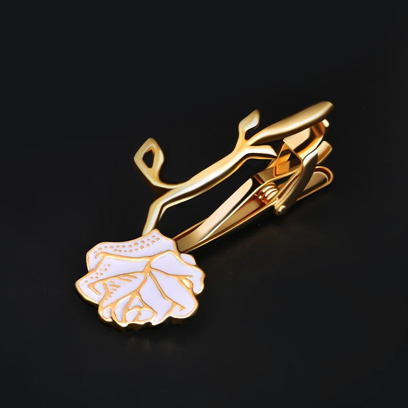 Give the gift of everlasting love with Our Heart’s Desire Eternal Tie Clip. Delicately painted white petals, trimmed in gold, are simple but elegant. This stunning, hand-crafted adornment can also symbolize loyalty, honor, and admiration. Our