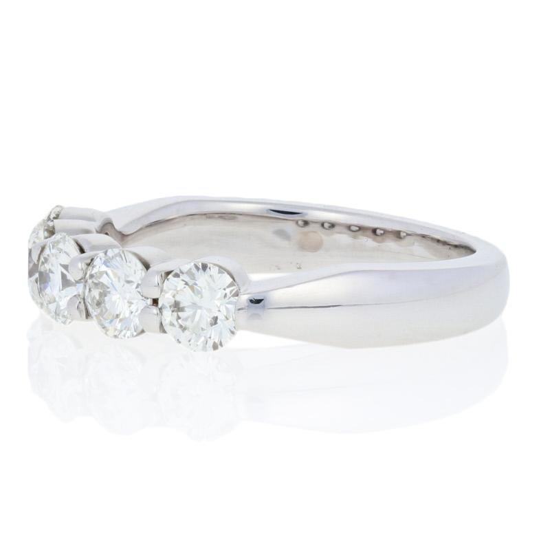 Originally retailing for $5650, this elegant designer wedding anniversary band is being offered here for a much more wallet-friendly price.

This ring is a size 5 1/4.

Brand: Hearts On Fire

Metal Content: Guaranteed 18k Gold as stamped

Stone