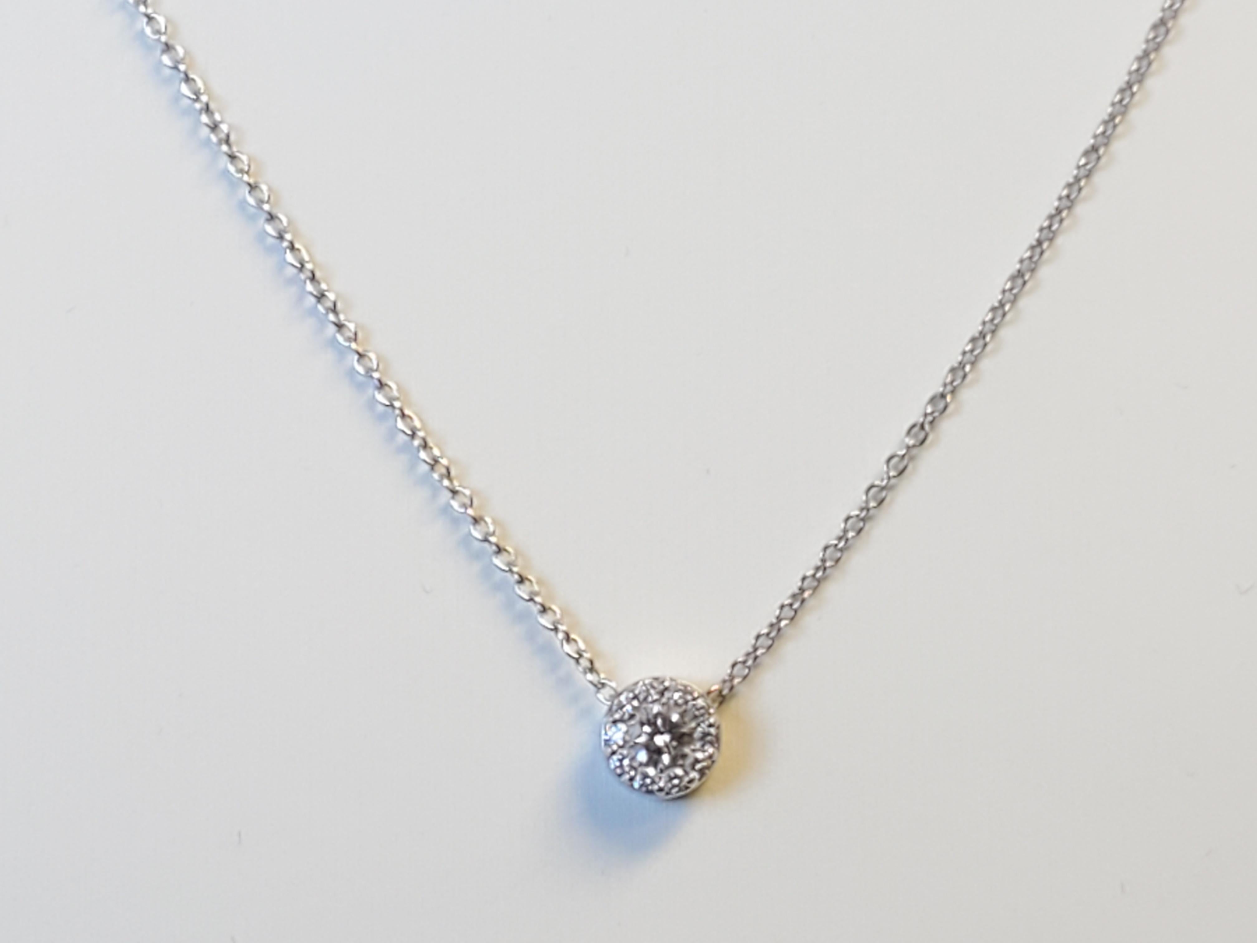 Listed is an estate 18k white gold Hearts on Fire diamond necklace. The tcw is approximately .25tcw nice clean I-J VS-SI1 diamonds. The pendant is stamped on the back as shown and the tag that connects to the clasp is stamped HOF. The necklace is in