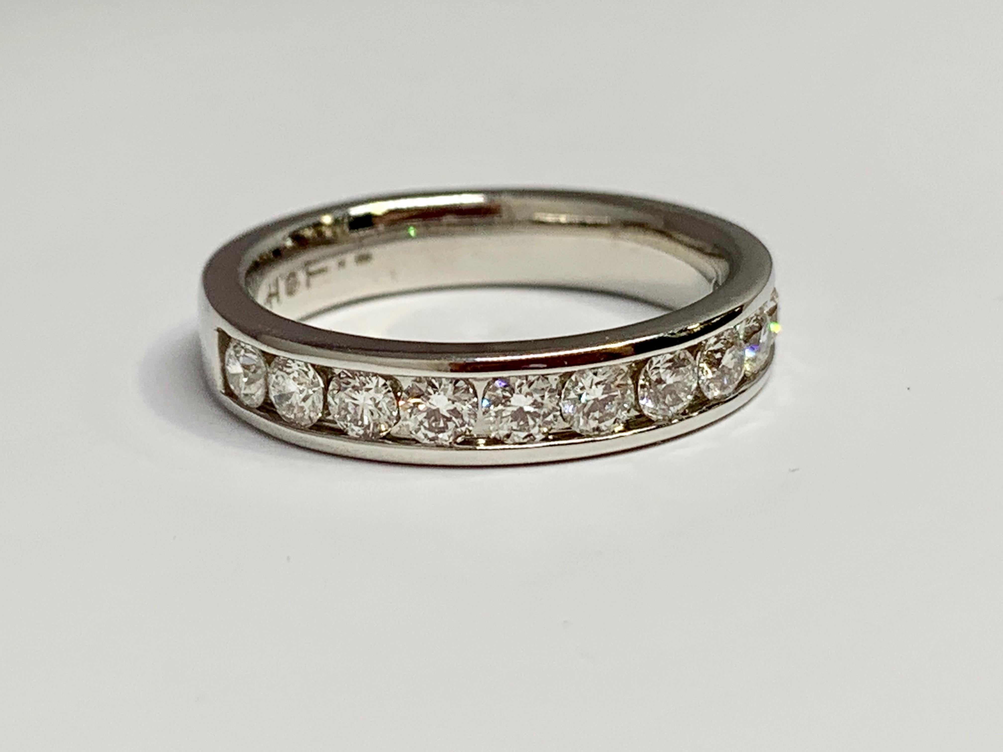 This Hearts On Fire channel-set diamond wedding band has a total carat weight of 0.94 carats. Hearts On Fire diamonds are the world's most perfectly cut diamonds, allowing for maximum light return and brilliance. The ring is 4.5mm wide and holds 11