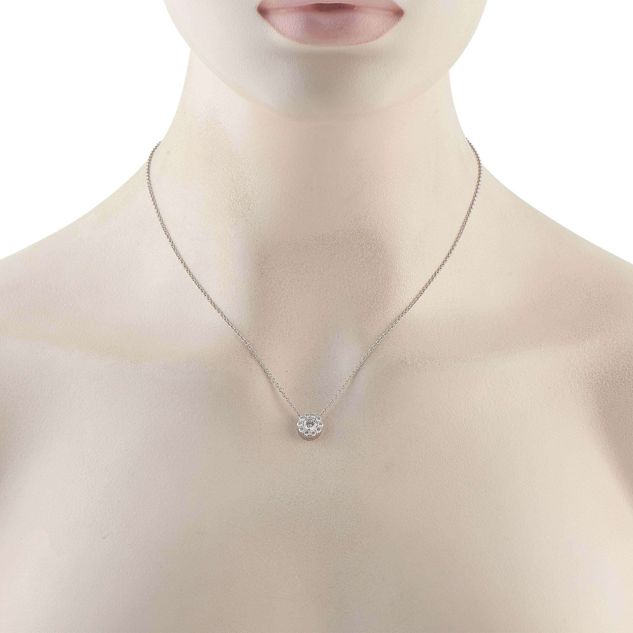 This Hearts on Fire necklace is stunning in its simplicity. Perfectly understated, it features a cluster of sparkling Diamonds totaling 0.95 carats suspended at the center of an 18 chain. Crafted from 18K White Gold, the central pendant measures