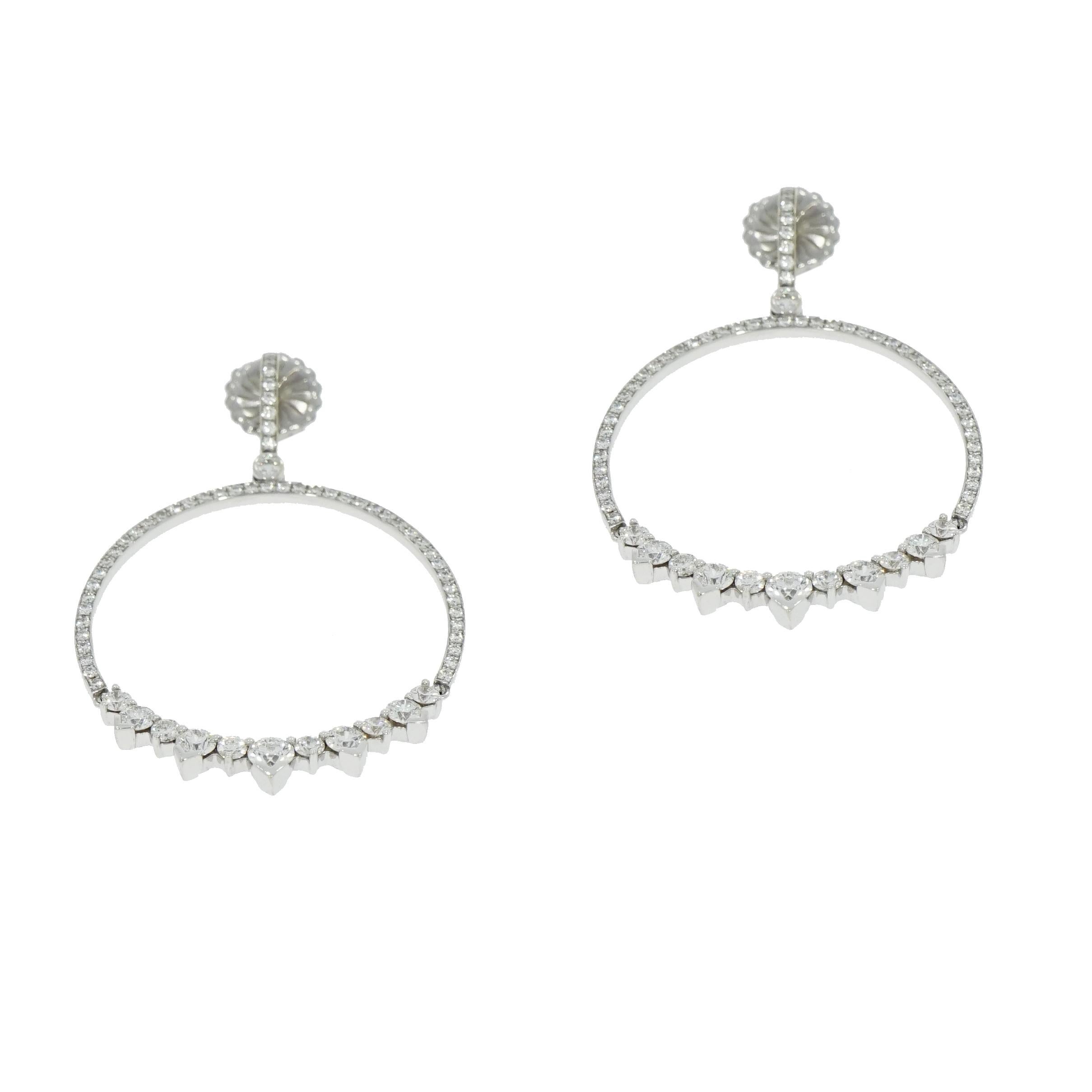 A truly timeless, yet chic design, this Aerial Eclipse Earrings are crafted by Hearts On Fire in 18k white gold and 3.25 carat of Diamonds total, with a post and friction backs. 
The sophisticated look of this diamond earrings with subtle drops