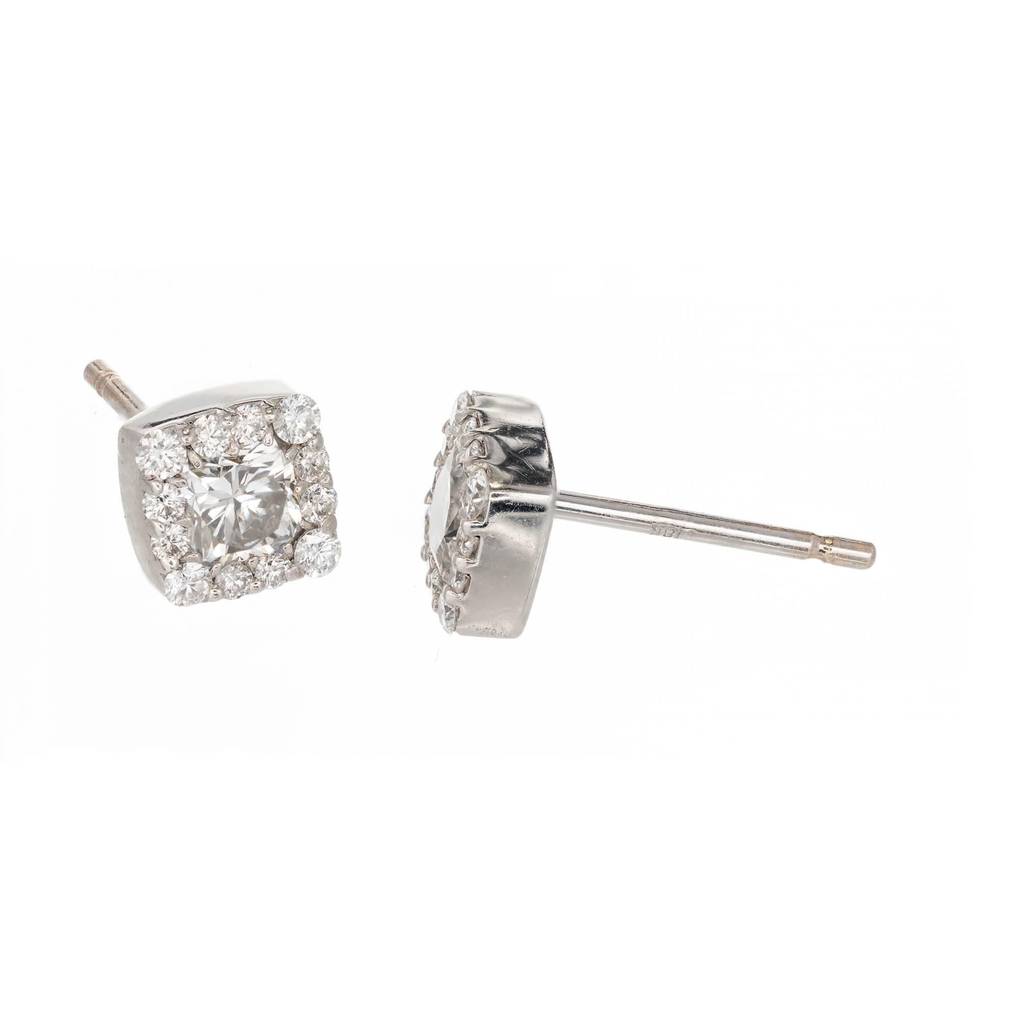 Hearts on Fire .72 carat square halo diamond stud earrings in 18k white gold. 2 center diamonds with a halo of round diamonds. 

2 3mm square modified cut diamonds, .56 ct total weight.  H, VS
20 round full cut diamonds, approx. total weight .16cts,