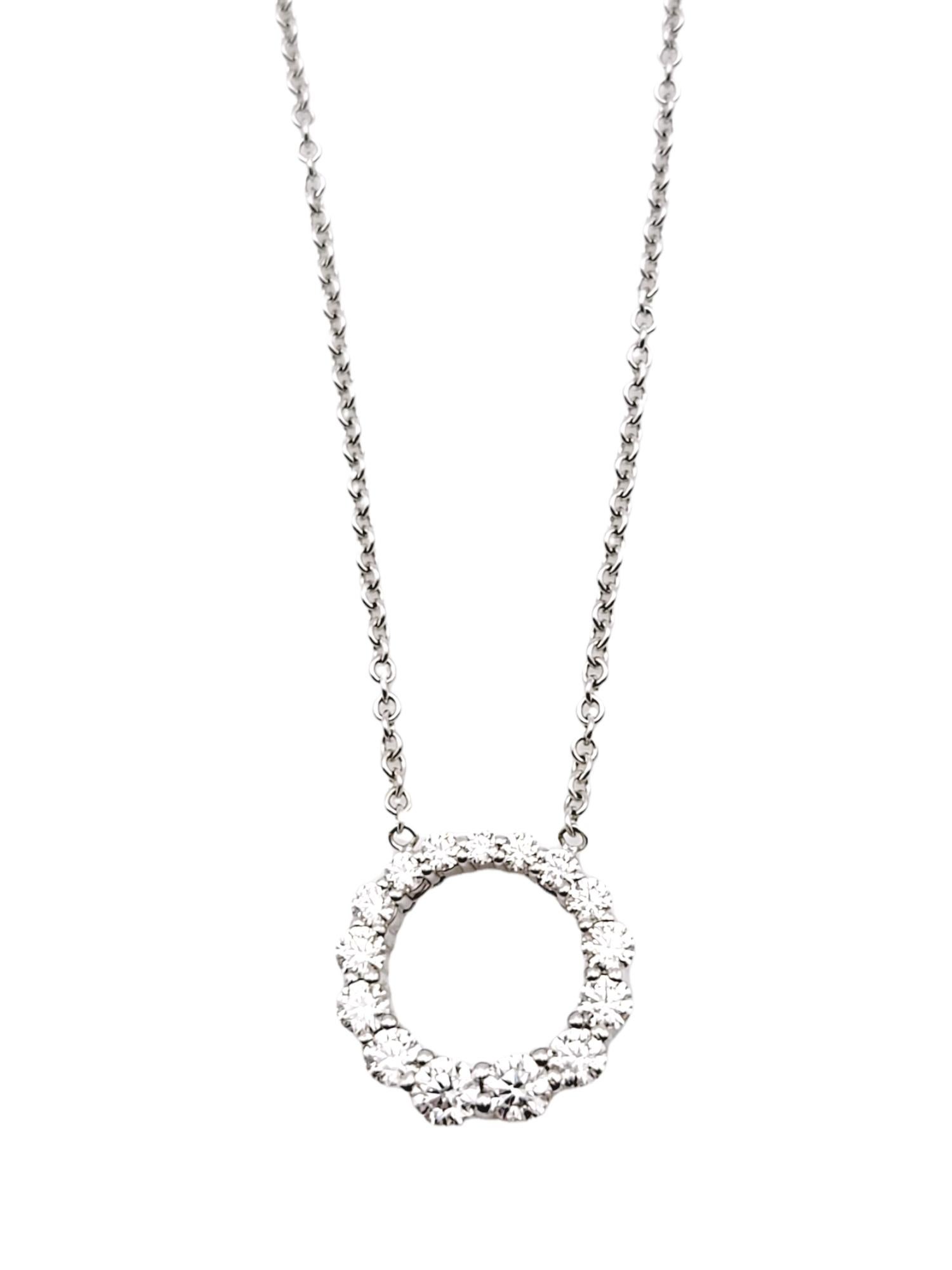 This sparkling diamond pendant necklace is stunningly simple, yet undeniably beautiful. The delicate chain and icy circle of graduated natural round diamonds goes with just about everything. The luxurious 18 karat white gold setting further enhances