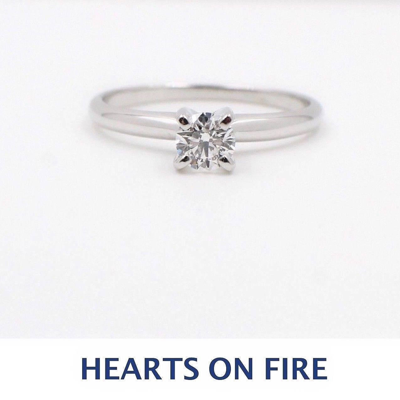 Brand: HEARTS ON FIRE
Style of Setting:  4-PRONG WHITE GOLD SOLITAIRE SETTING
Serial Number:  HOF 43209
Metal:  WHITE GOLD
Metal Purity:  14KT
Size: 6.75 - sizable
Total Carat Weight:  0.362CTS
Diamond Shape:  HEARTS ON FIRE ROUND BRILLIANT
Diamond