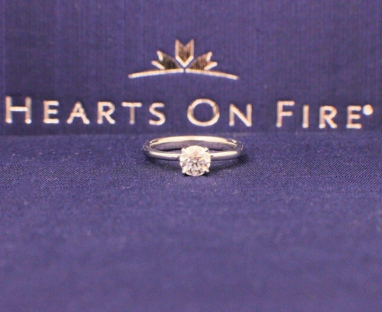 Brand:  HEARTS ON FIRE
Stye:  4-Prong Solitaire Engagement Ring
Serial Number: AGS 0003059009
Metal:  White Gold
Metal Purity:  750
Size: 6.75
Total Carat Weight:  0.667 CTS
Diamond Shape:  Round Brilliant Diamond
Diamond Color & Clarity:  H-IF