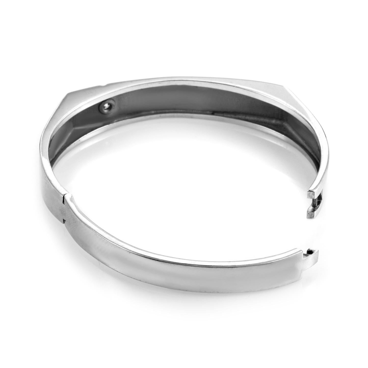 Modern Gents bracelet in 18K White Gold and diamonds from Hearts on Fire. <br />The polished white gold has a squared off center design with one diamondbezel set off to the side. <br />The bracelet has an easy opening and this allows the bracelet to