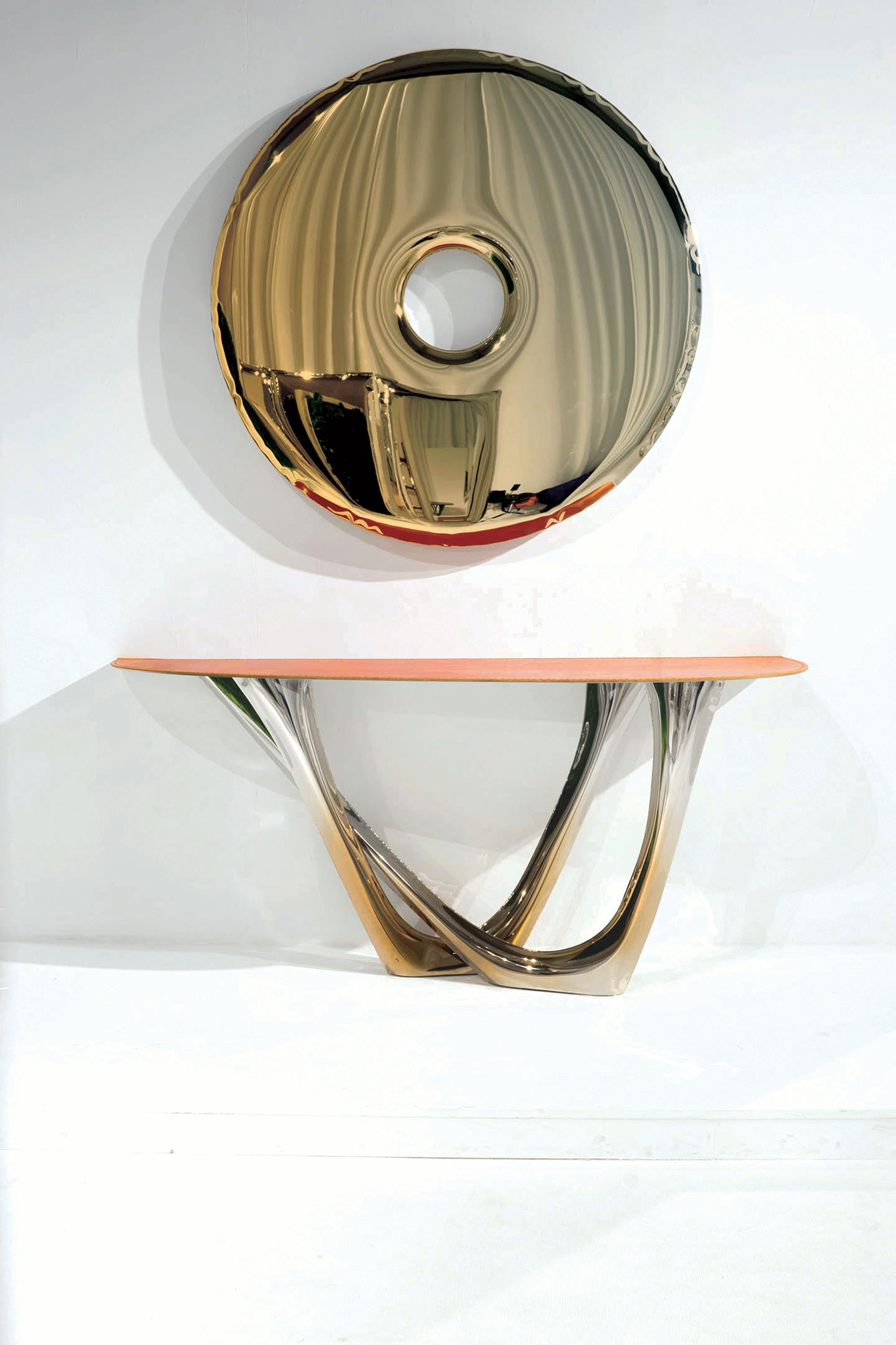 Limited edition mirror in flamed gold polished stainless steel.