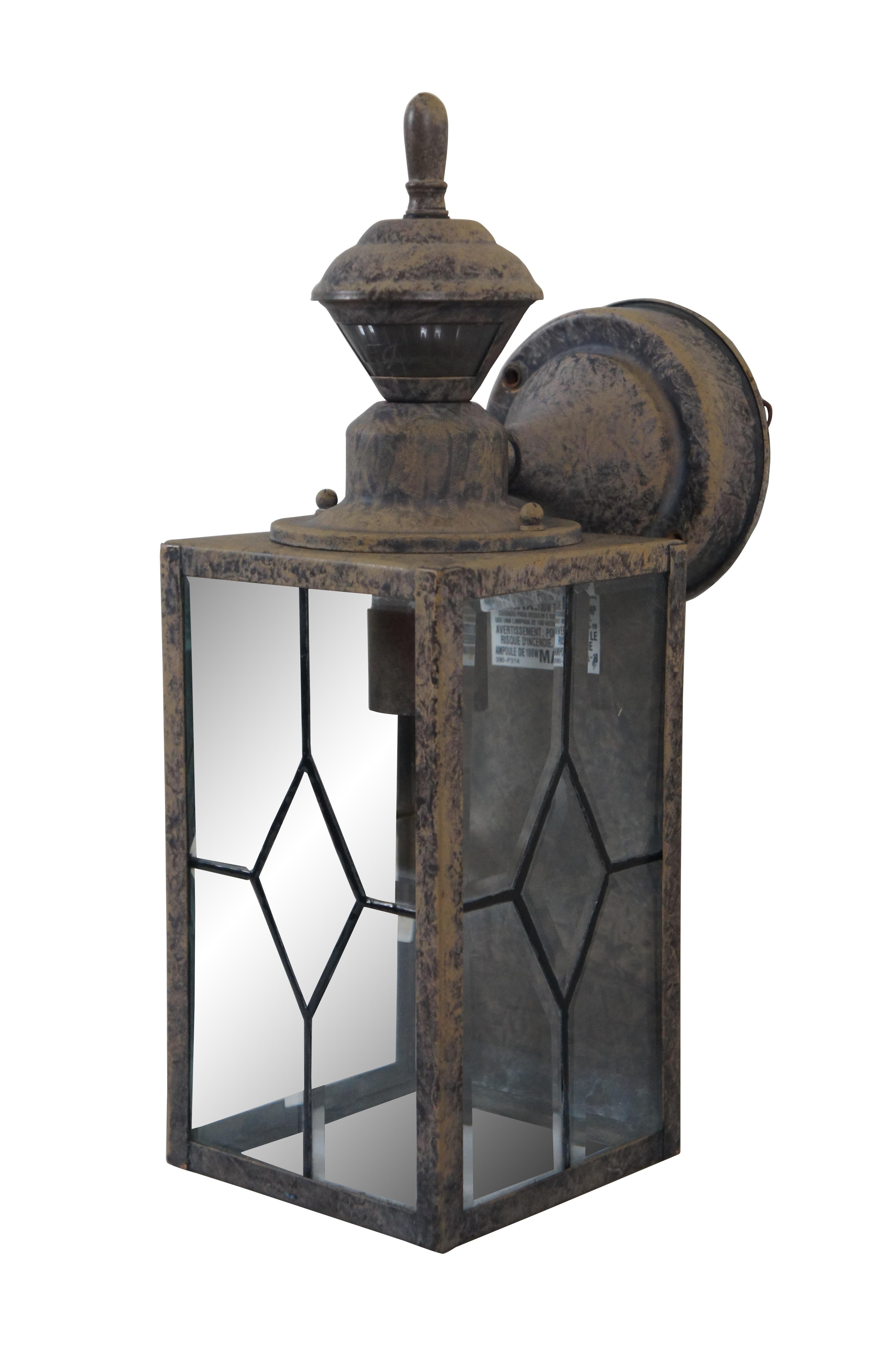 Heath Zenith SL-4151-B Single Light High Outdoor Wall Sconce - Motion Sensor Activated. Diamond pane faux leaded beveled glass panels in a mottled black and beige  painted metal housing.

Features:
- Detection range up to 30 feet
- Rotatable sensor