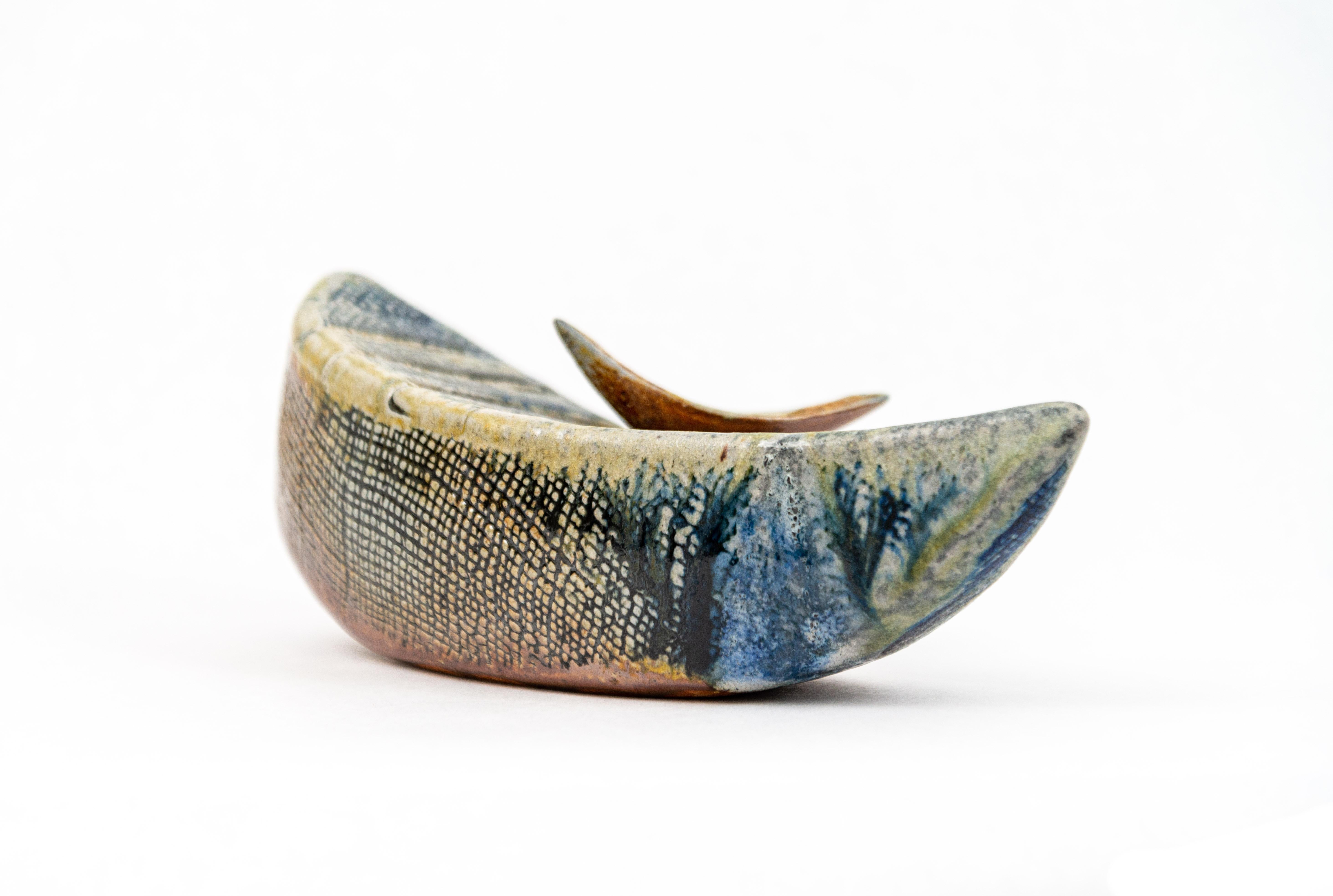 Ethereal. Beautiful. Heather Allen Hietala’s series of ceramic vessels are hand built from clay, formed and fired into boat-like shapes. For Hietala, the vessel is symbolic of life’s journey. The shining fragments of glass from recycled pickle jars
